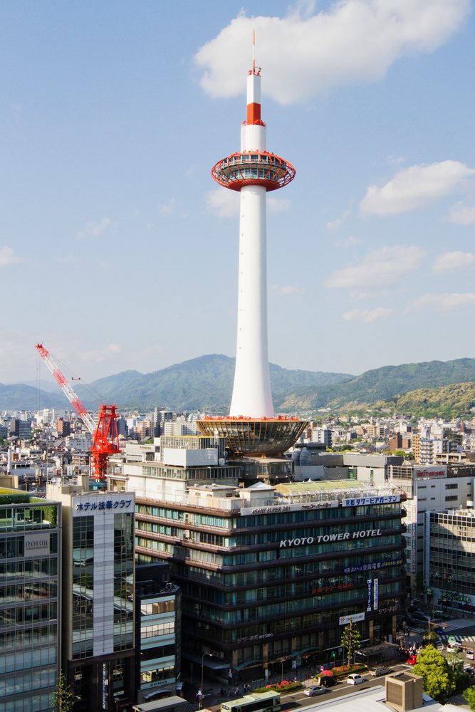 Kyoto tower observation tower rising above cityscape, japan