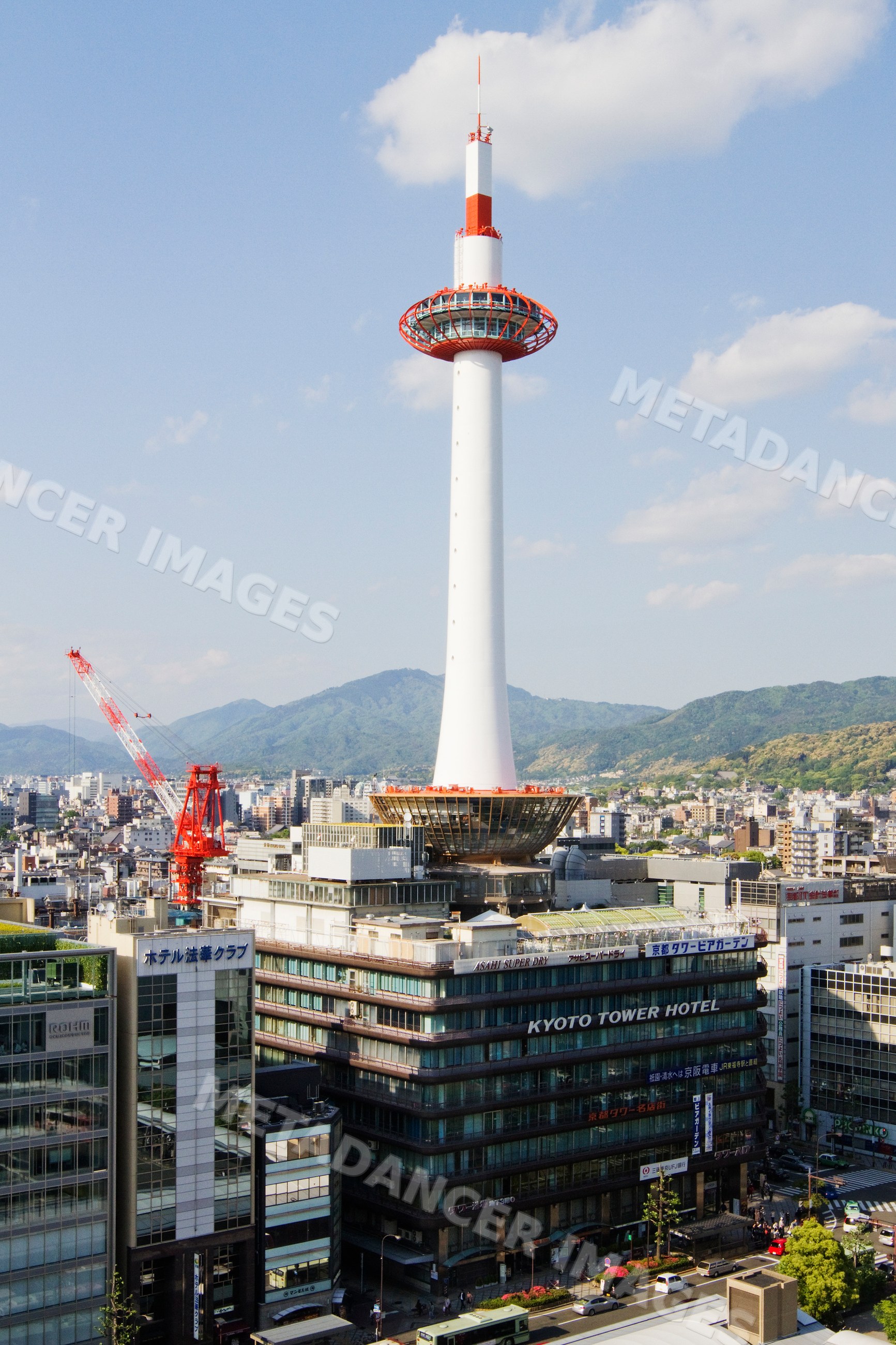 Kyoto tower observation tower rising above cityscape, japan