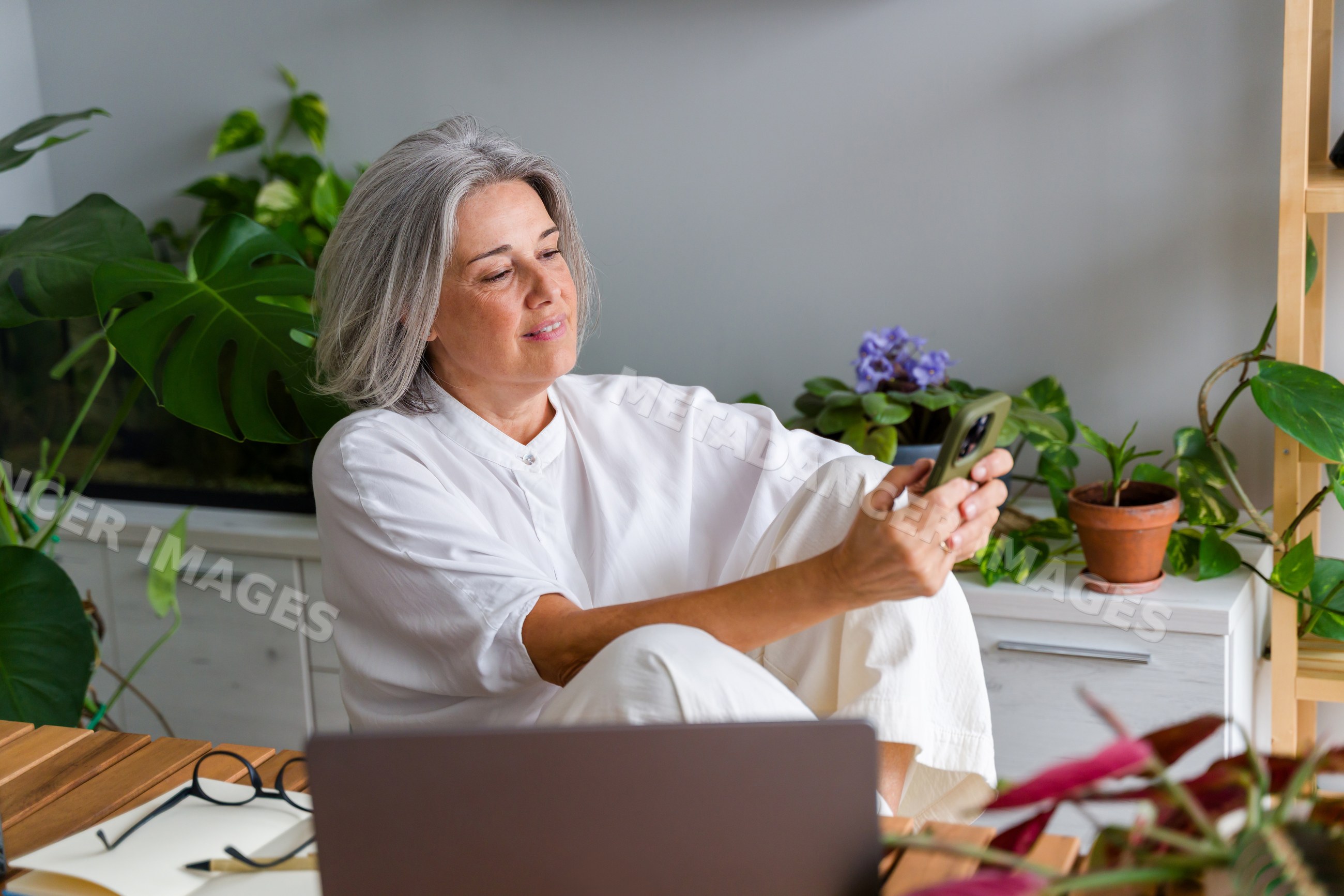 Middle aged white woman using smartphone
