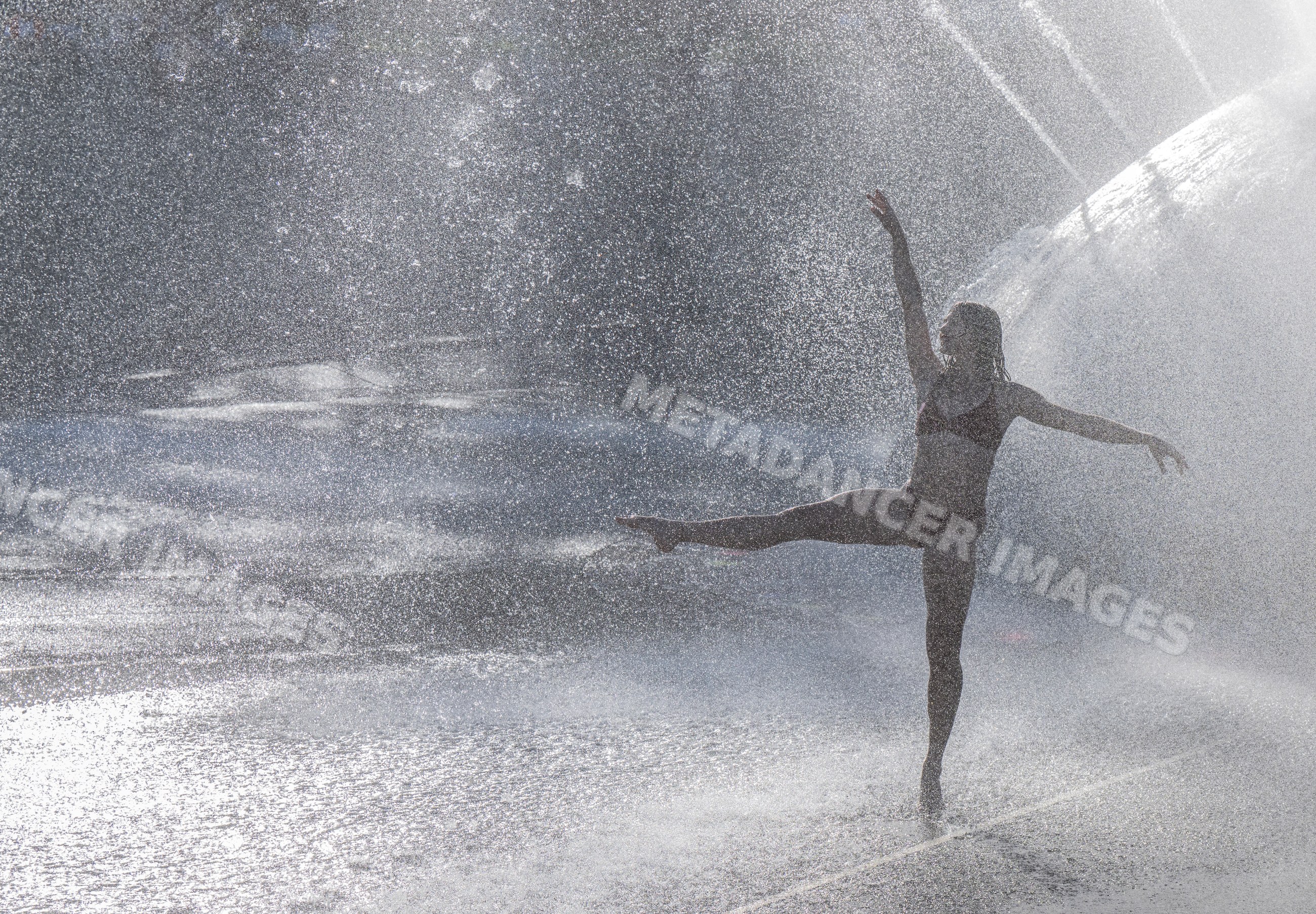 White woman performing ballet pose