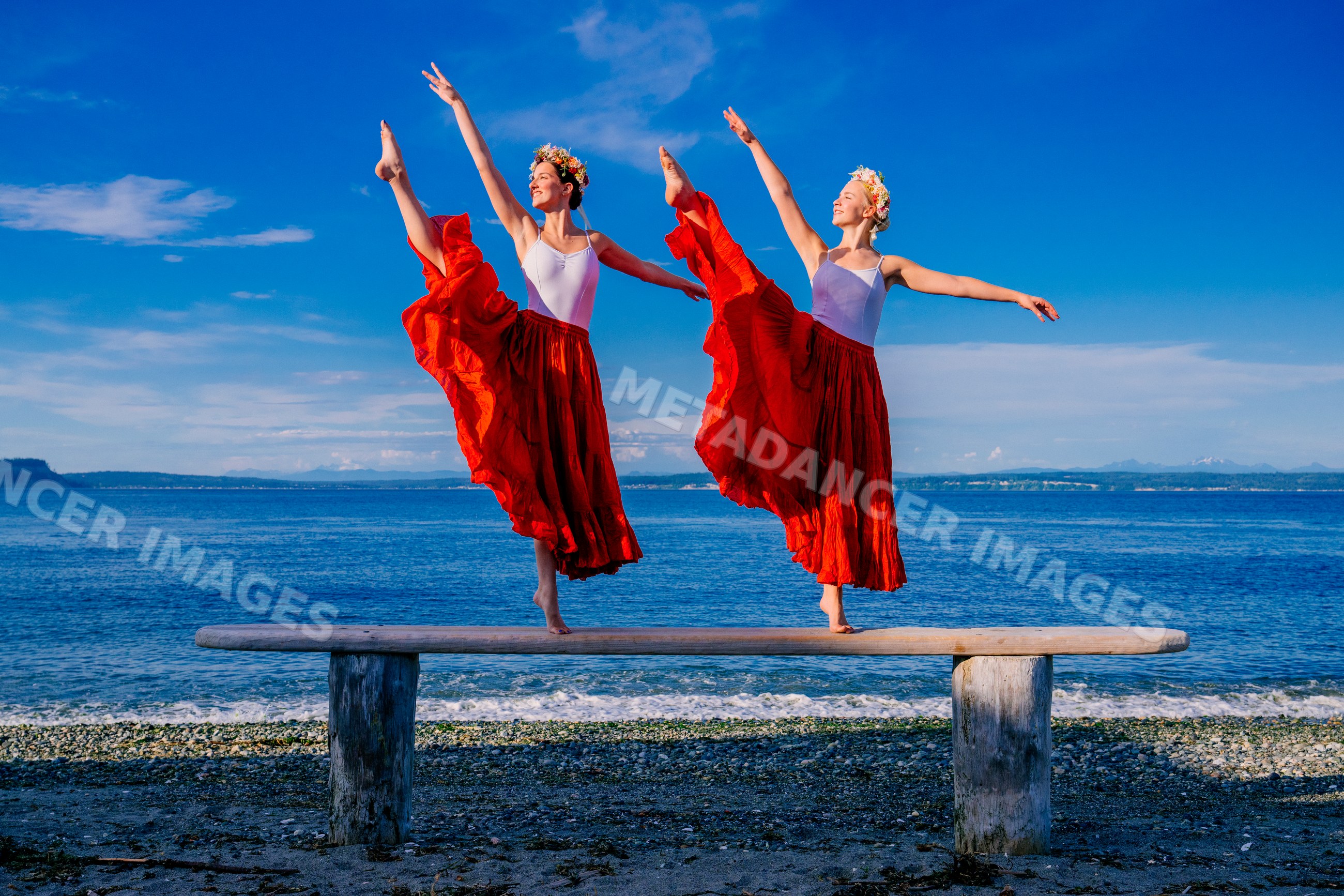 Two female dancers balance featuring a white model