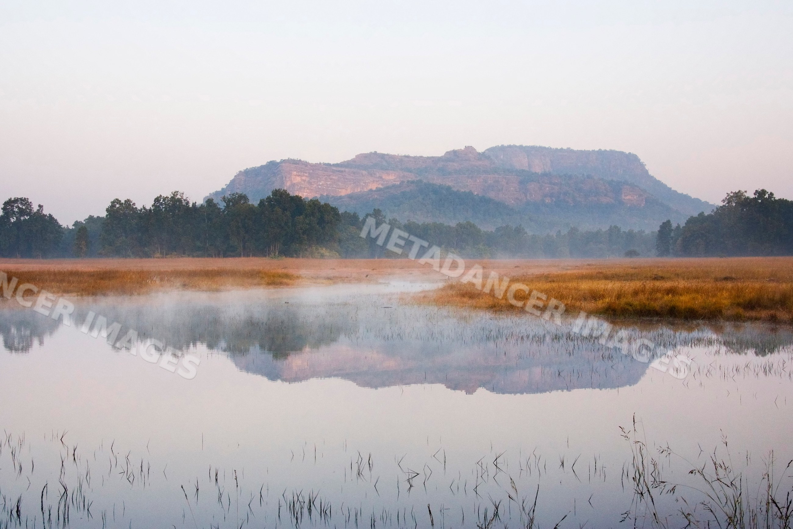 Bandhavgarh national park misty water and hills landscape, india