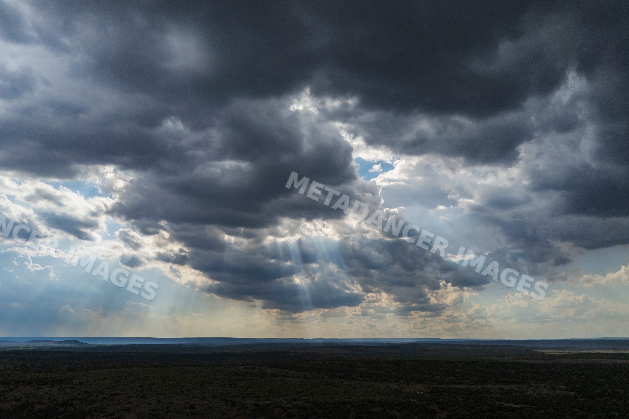 Crepuscular Rays piercing storm clouds over Great Plains