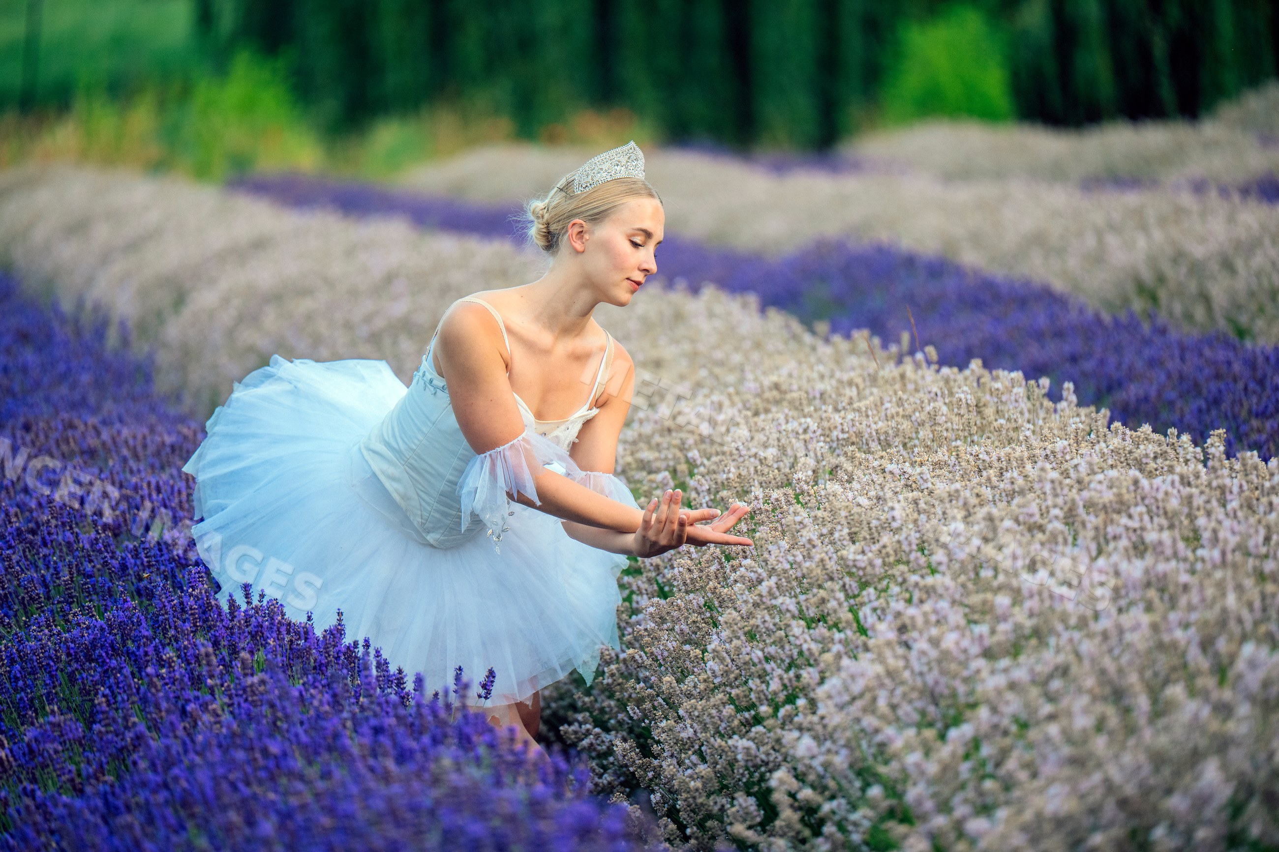 A white female dancer poses gracefully