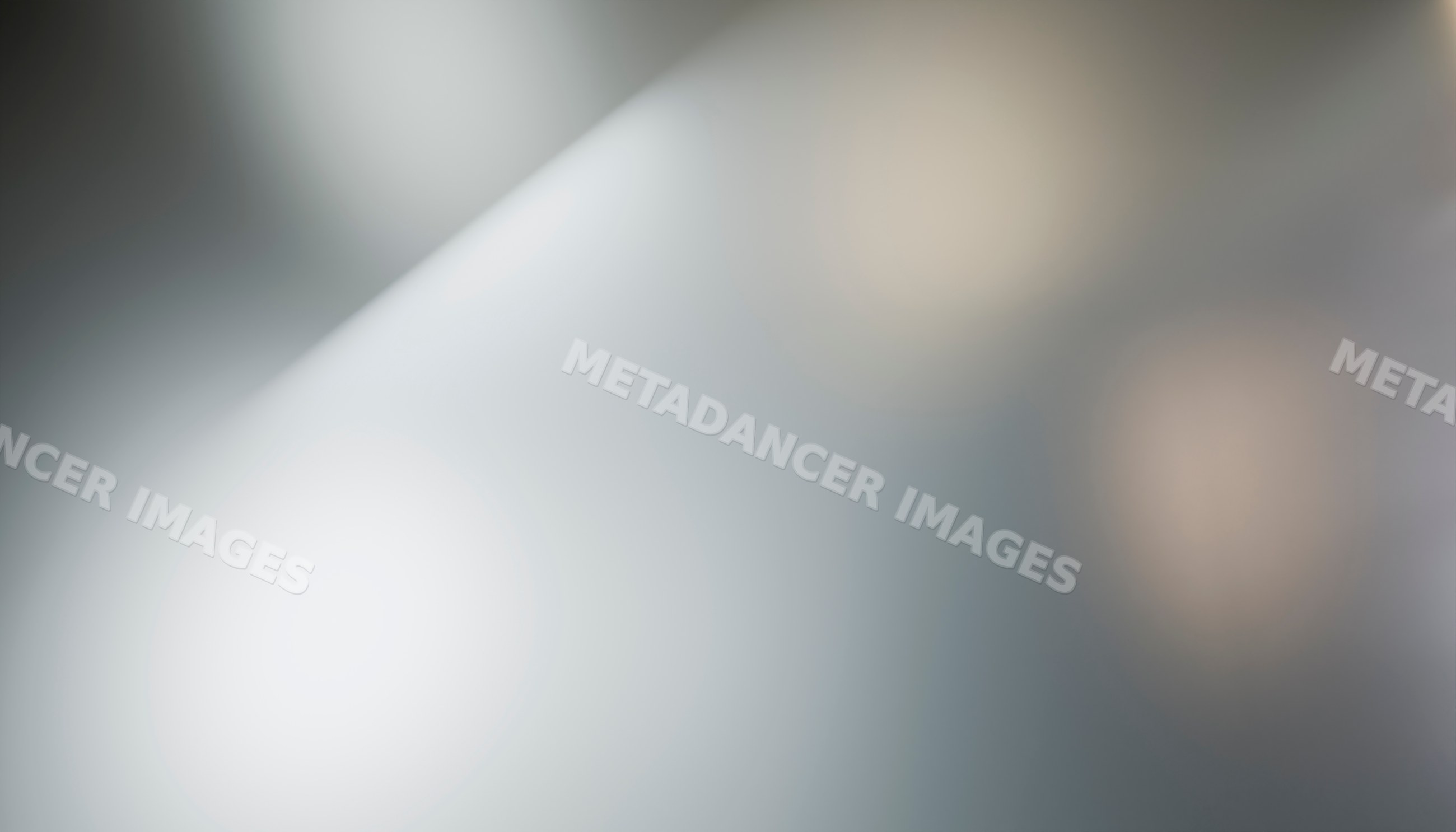 Blurred abstract background with soft lighting and neutral gray