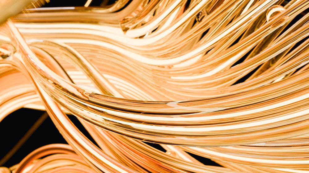 Close-up of shiny coiled copper wires in abstract pattern