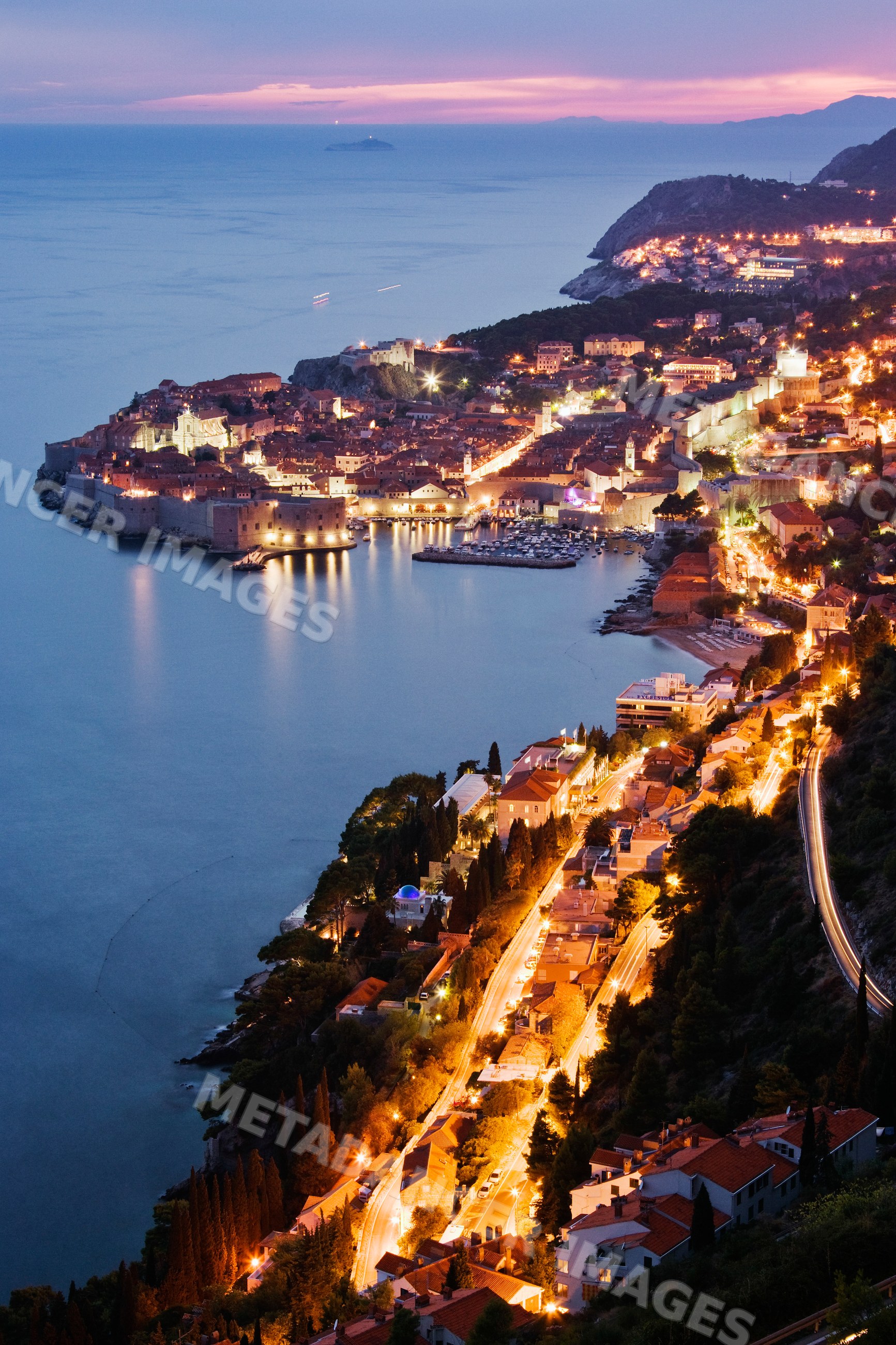 Old city of dubrovnik with sea and coastline lights