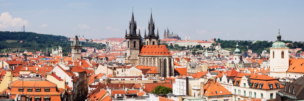 Panoramic view of prague cityscape with historic cathedral towers