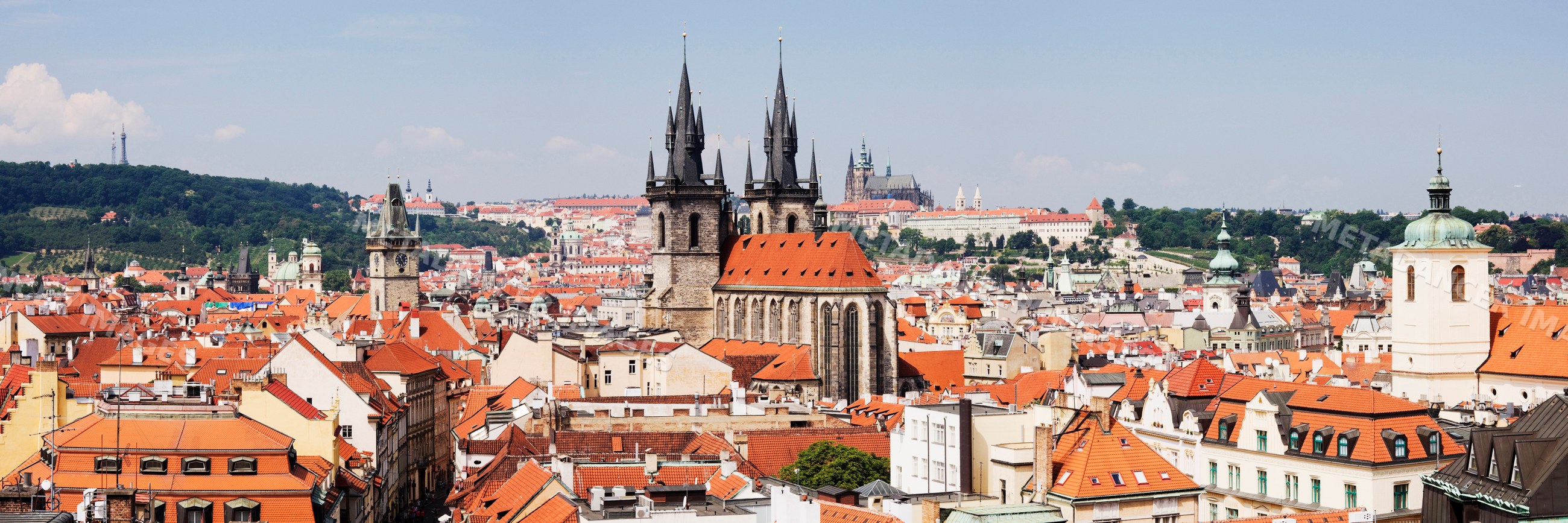Panoramic view of prague cityscape with historic cathedral towers
