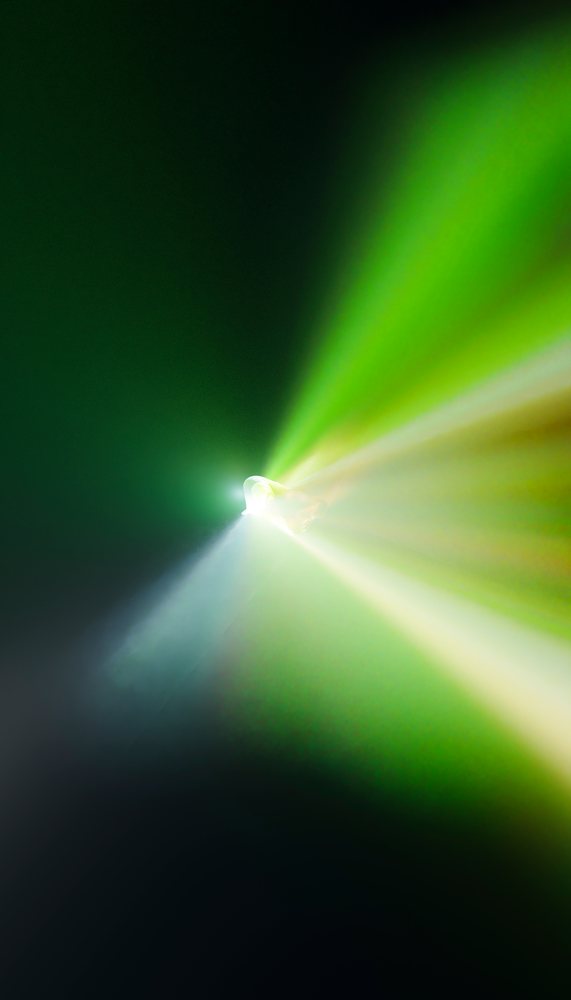 Bright green and white beam of light creating an abstract glowing