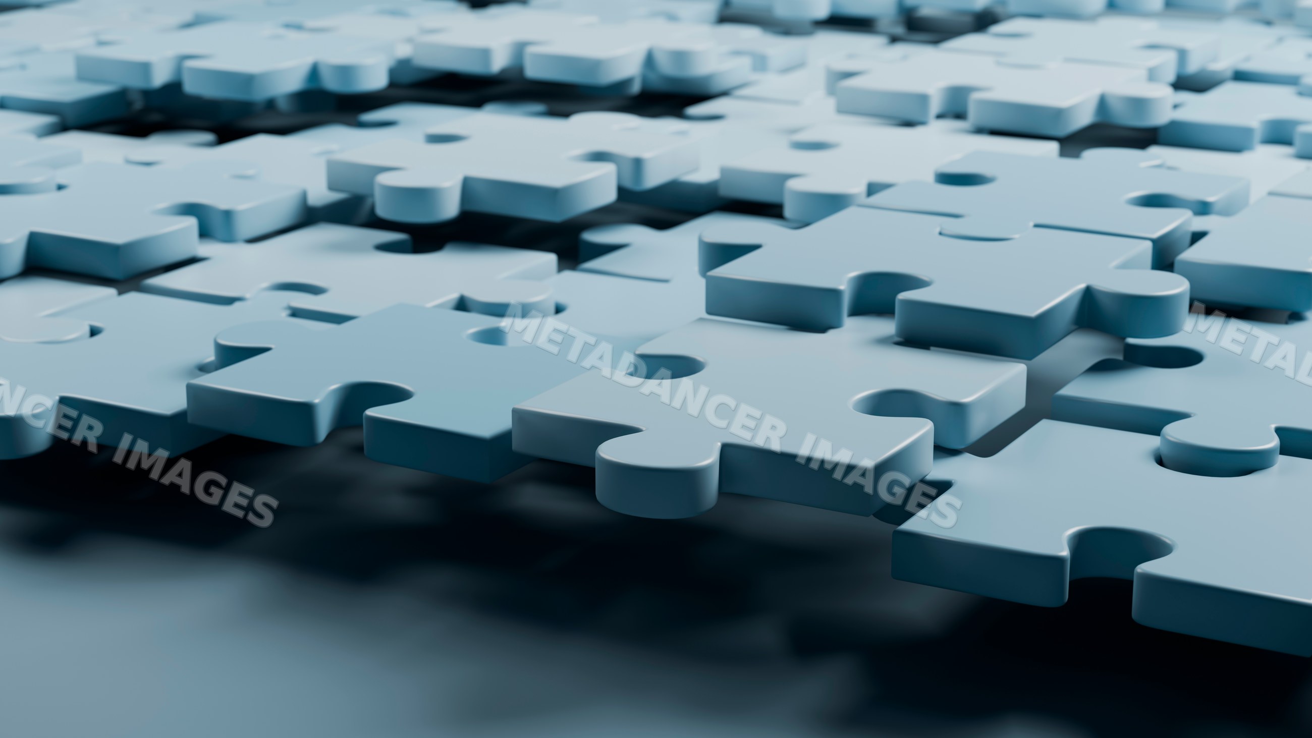 Blue interlocking puzzle pieces on flat surface