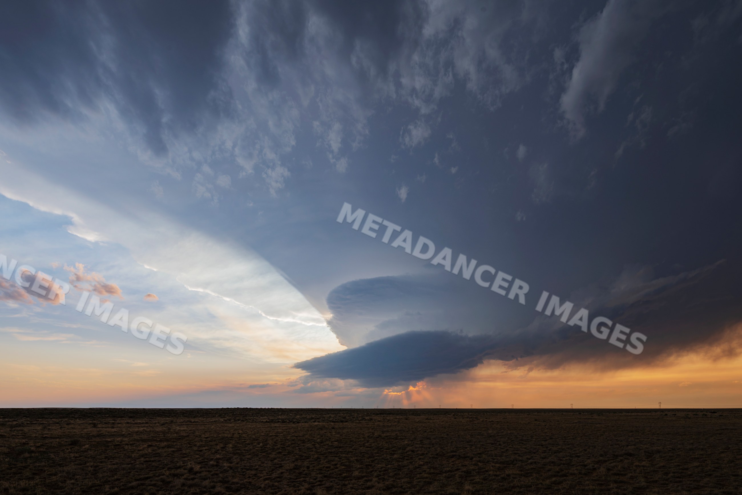 Storm clouds gathering over prairie at sunset in olney springs