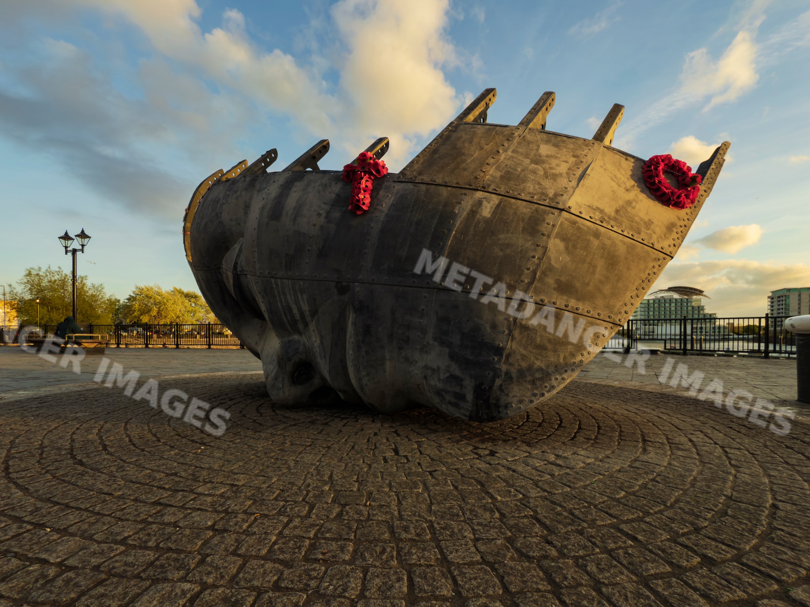 Ship's Prow metal sculpture with memorial wreaths