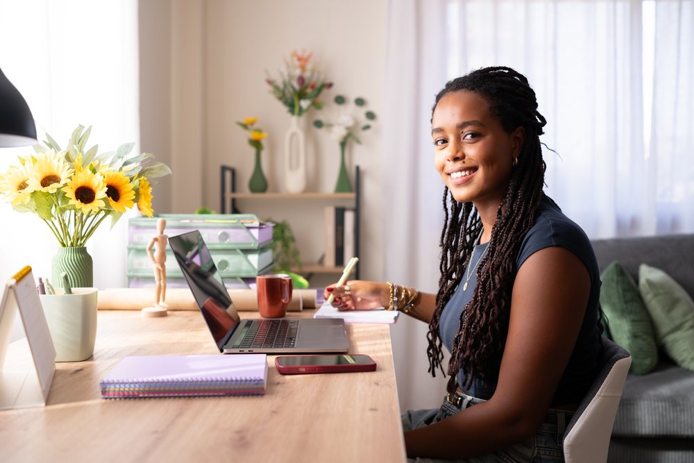 Young African American woman writing notes