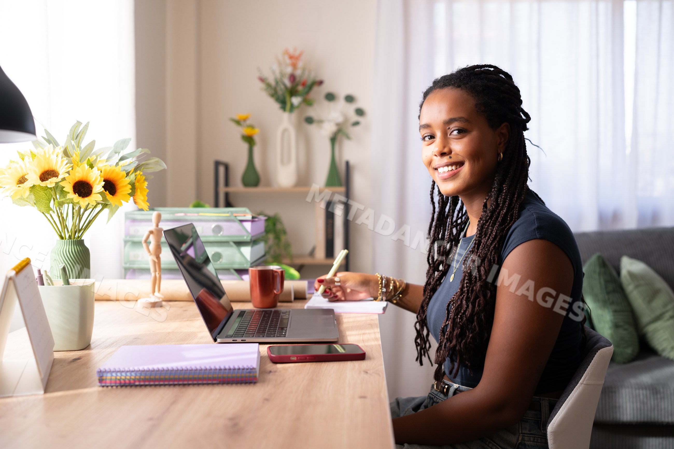 Young African American woman writing notes