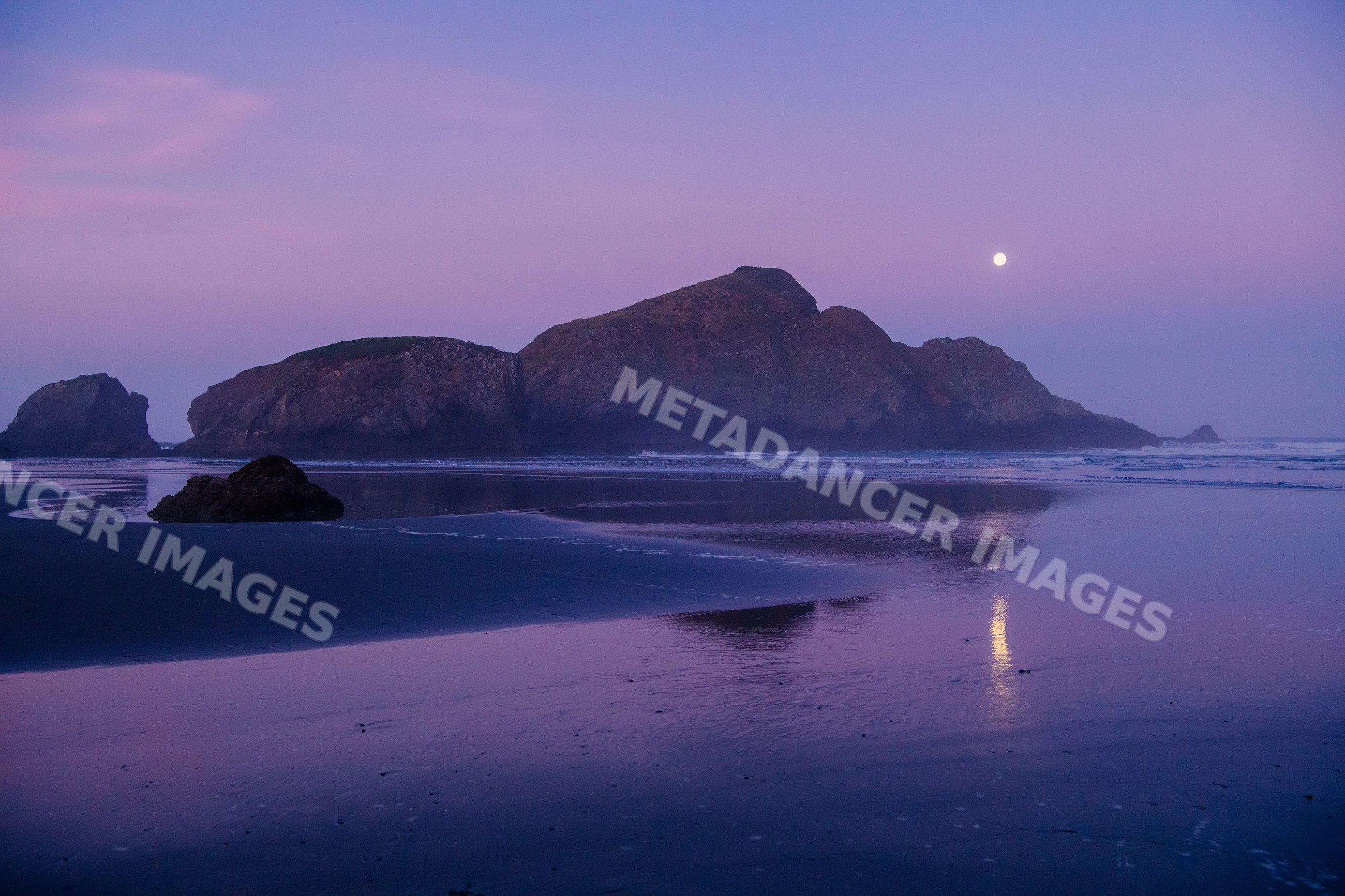 Rocky island reflecting moonlight