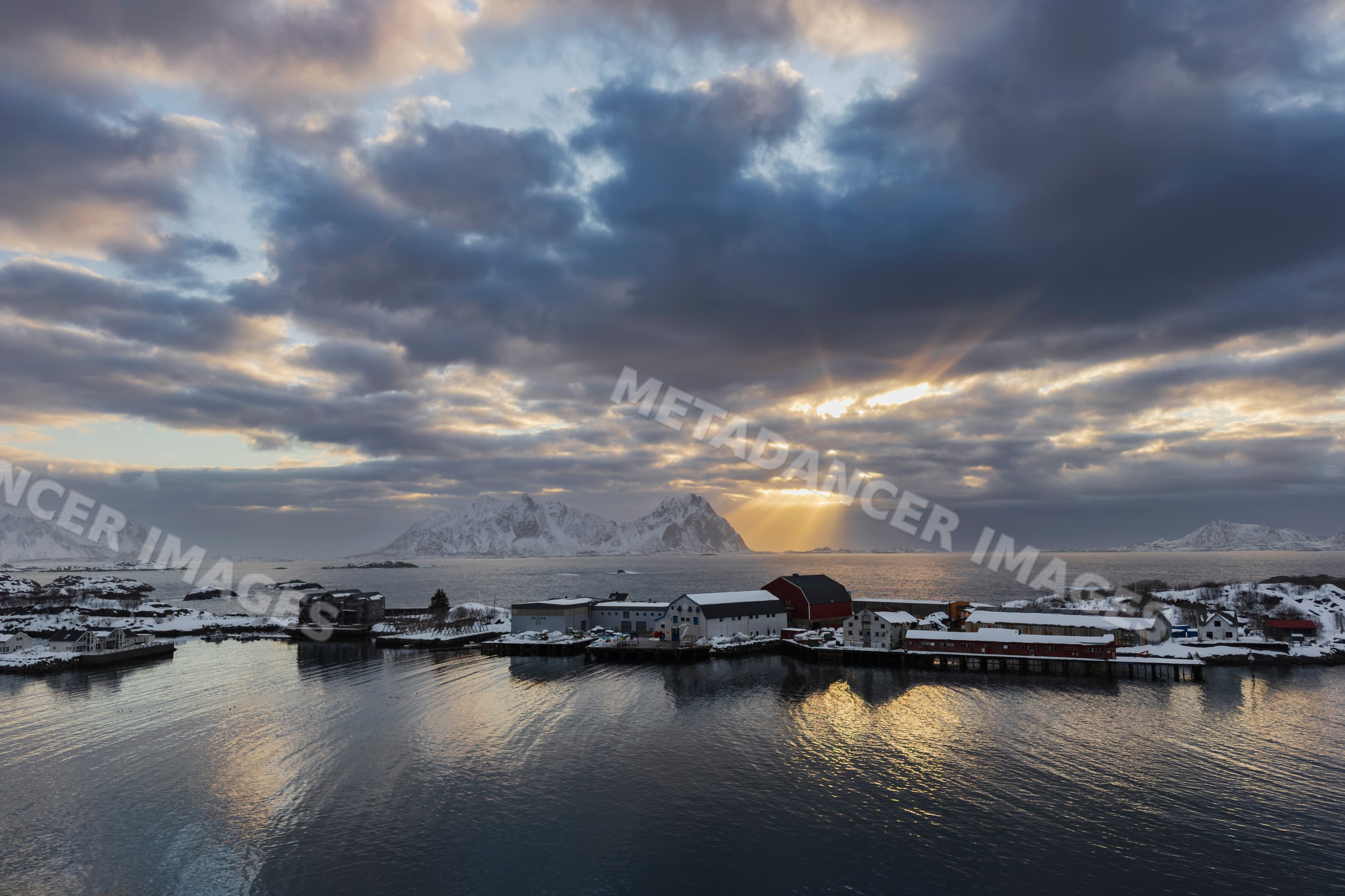 Sunrise over snowy mountains and sea at Svolvaer in Lofoten Norway