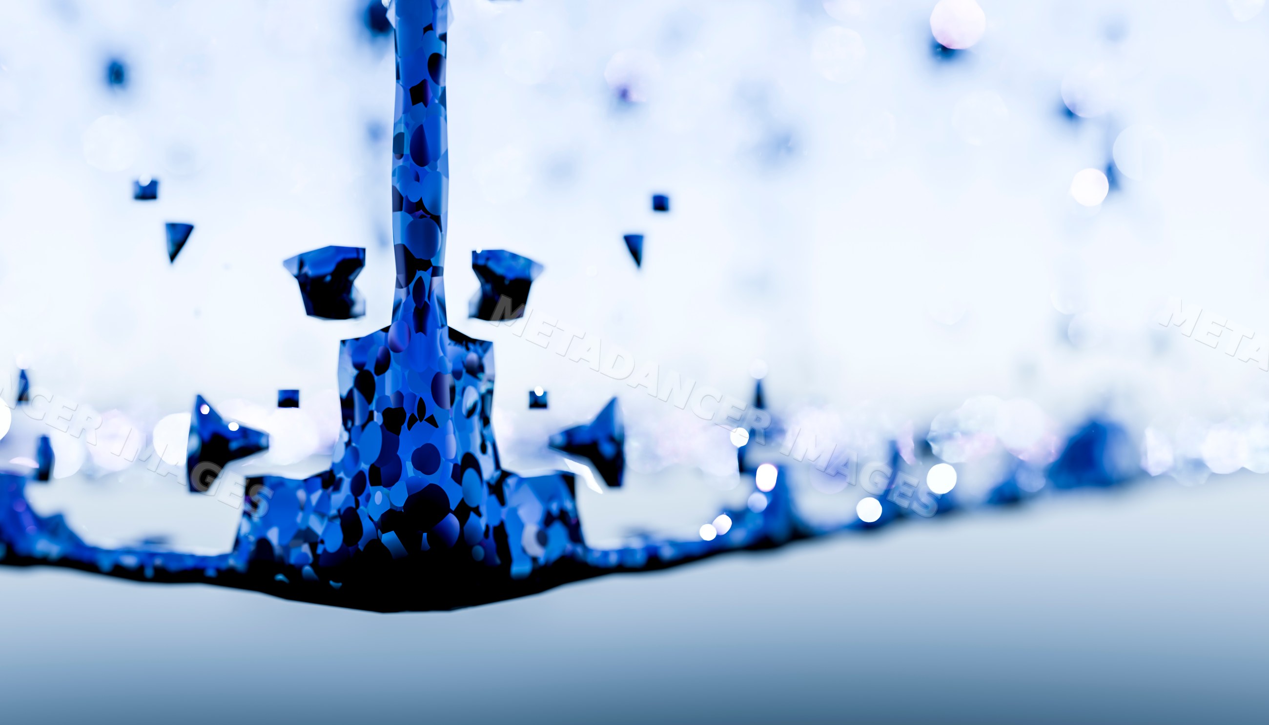 Blue water splash with droplets captured in close-up
