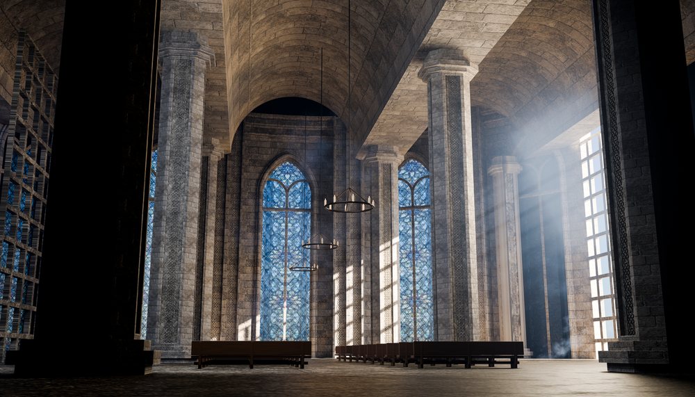 Cathedral interior with vaulted stone arches and stained glass windows