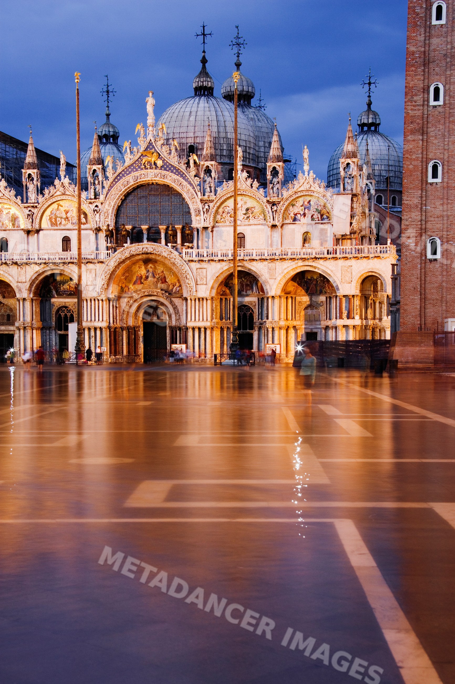 St mark's square cathedral illuminated at evening in venice, veneto