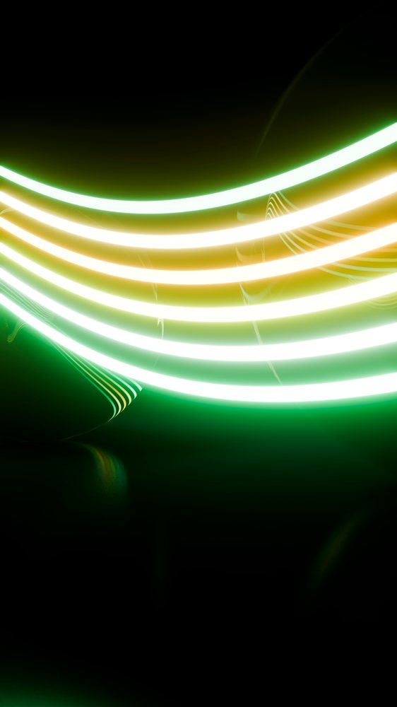 Glowing green and yellow abstract light streaks over dark background