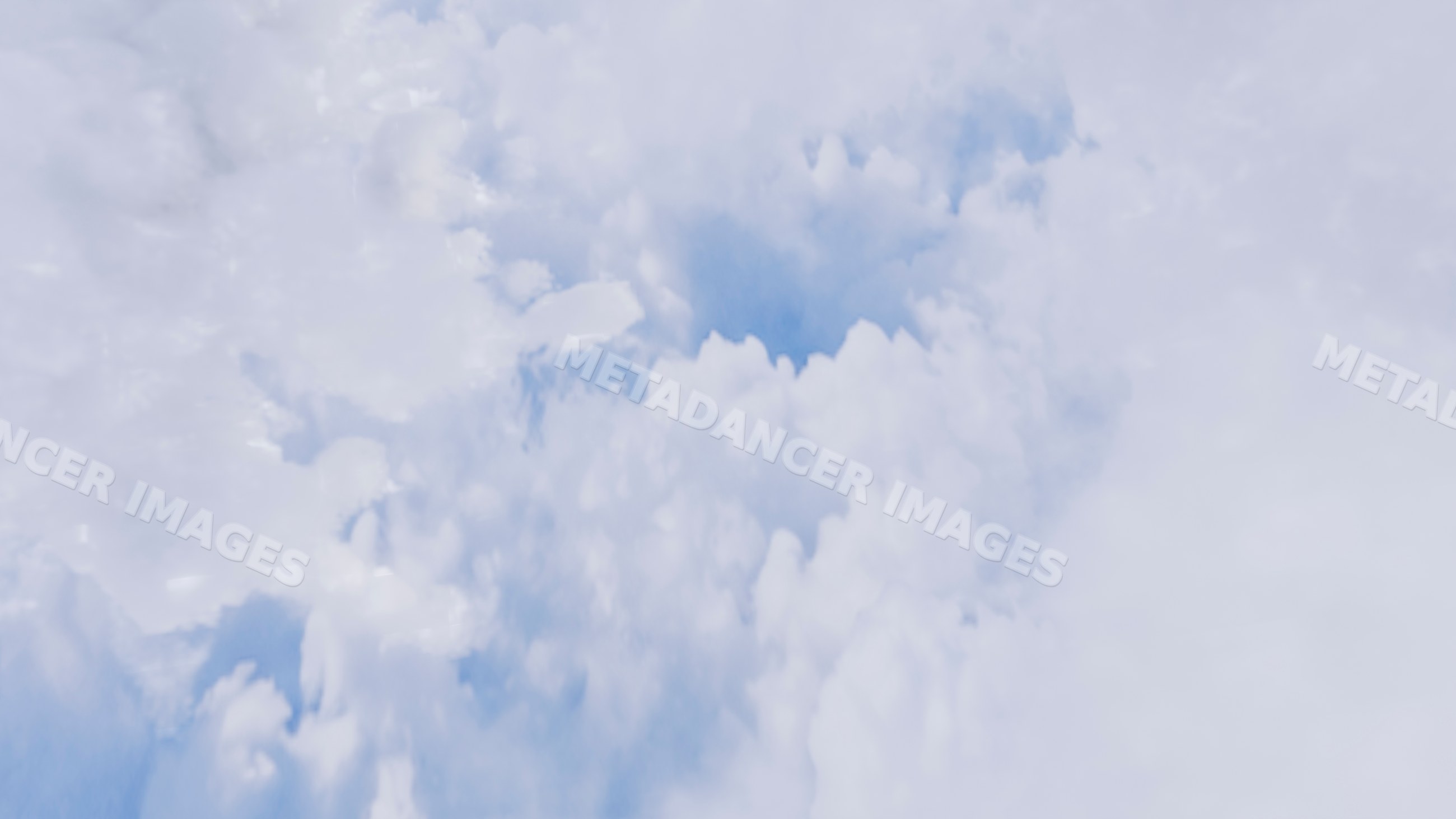 Clouds filling the sky with blue patches visible