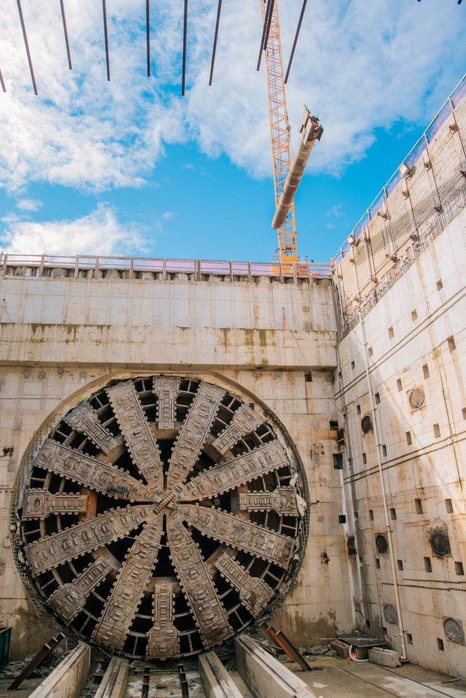 Tunnel boring machine at a USA construction site with crane lifting