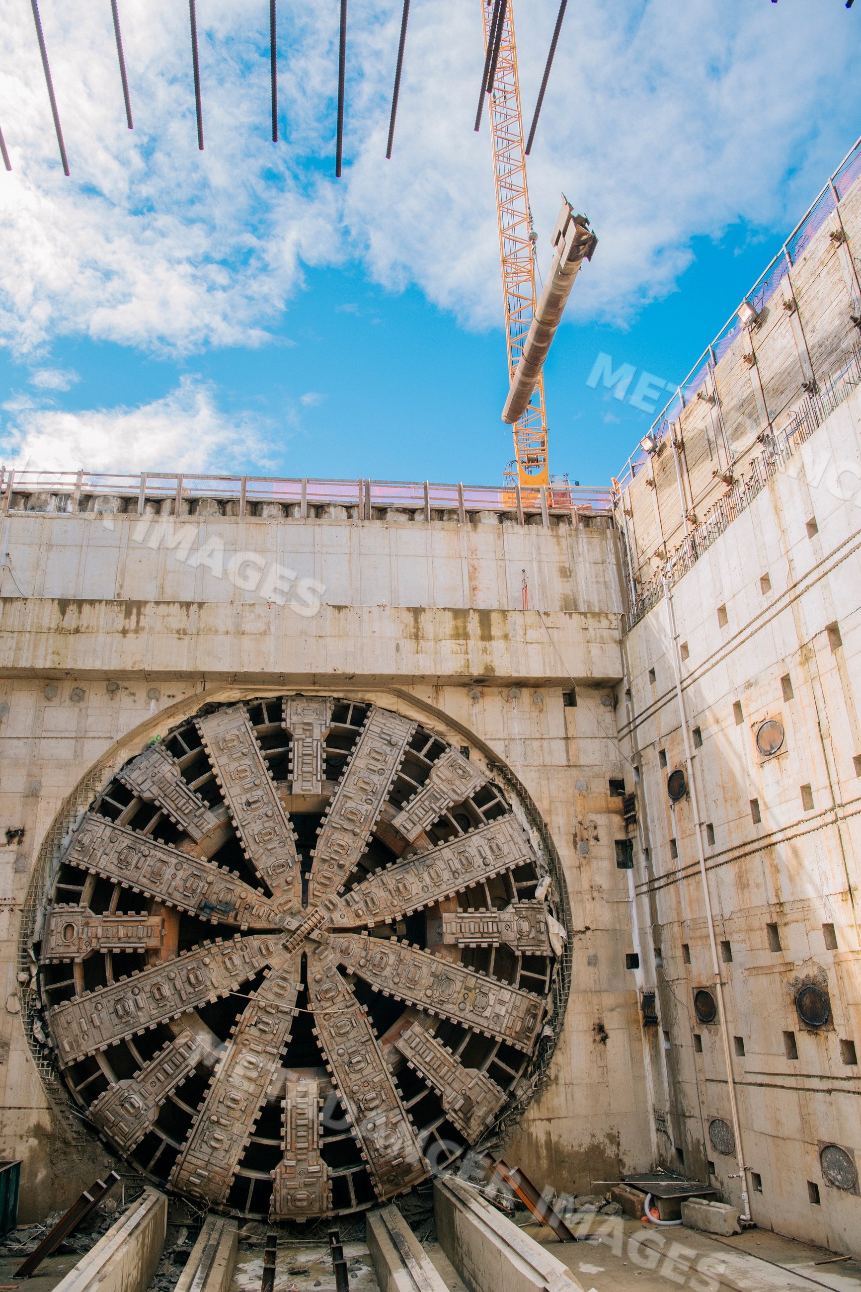 Tunnel boring machine at a USA construction site with crane lifting