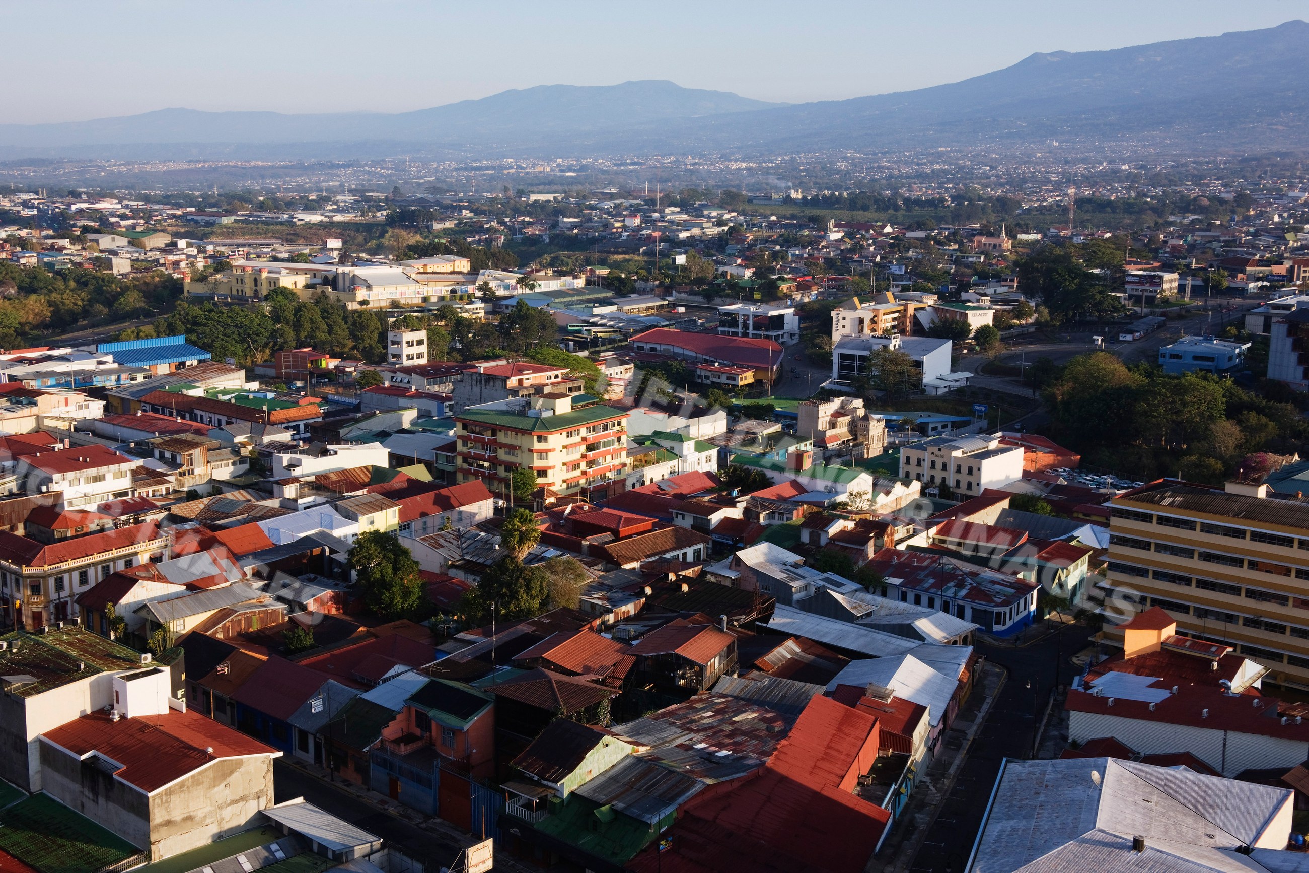 Cityscape of san jose with urban rooftops and distant mountains