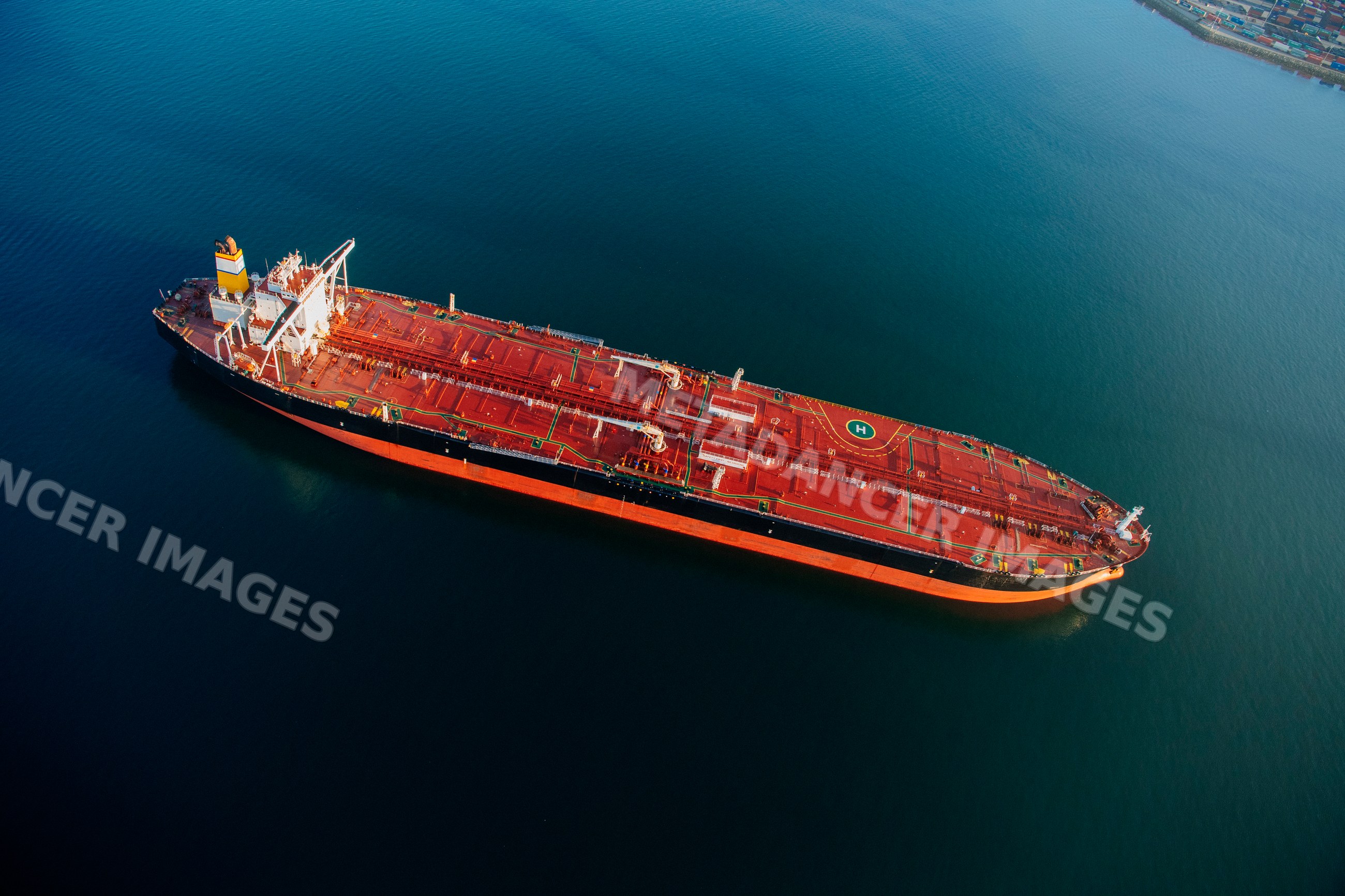 Oil tanker cargo ship anchored in a beach