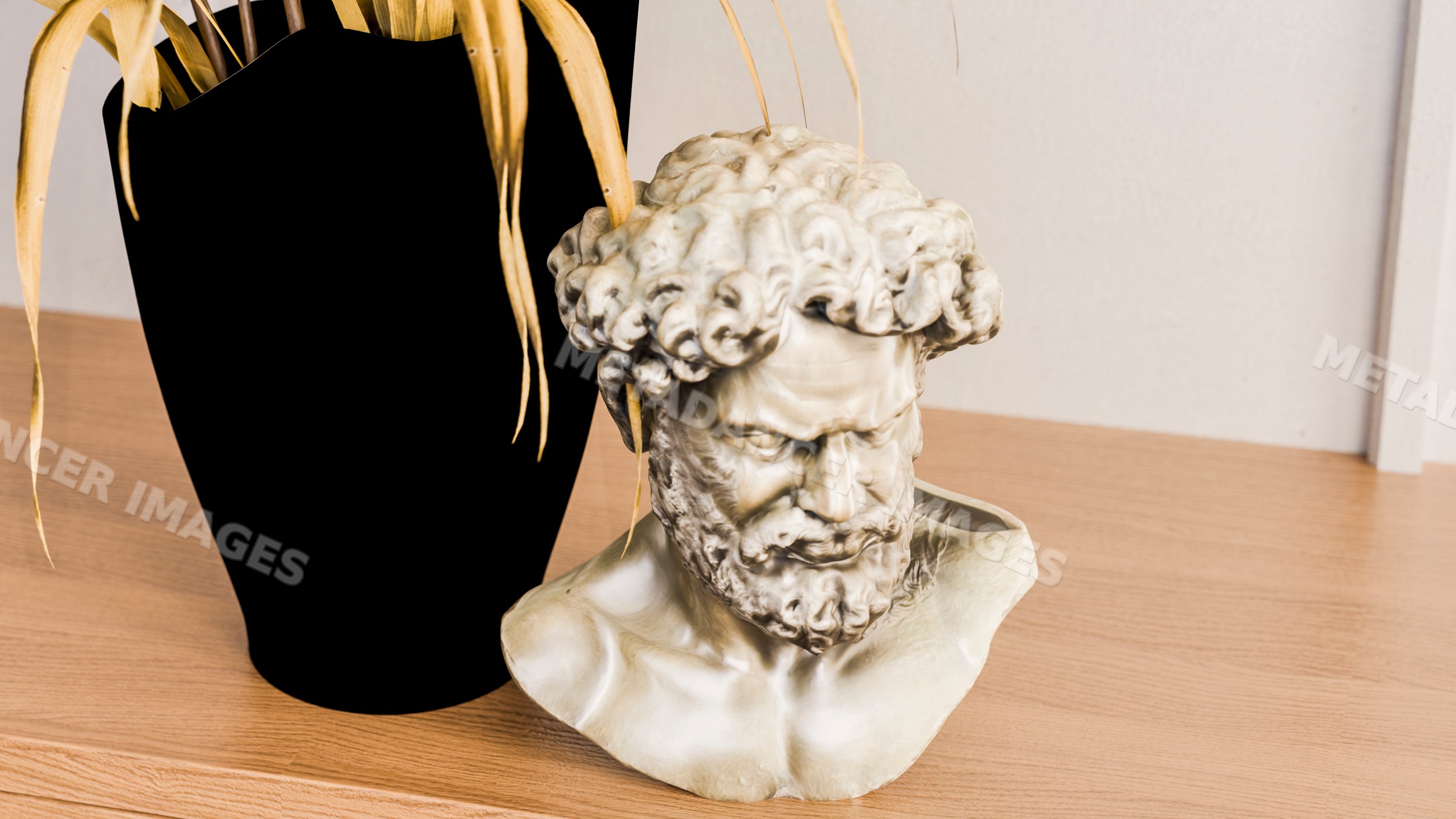 Classical marble bust sculpture of bearded man on wood table