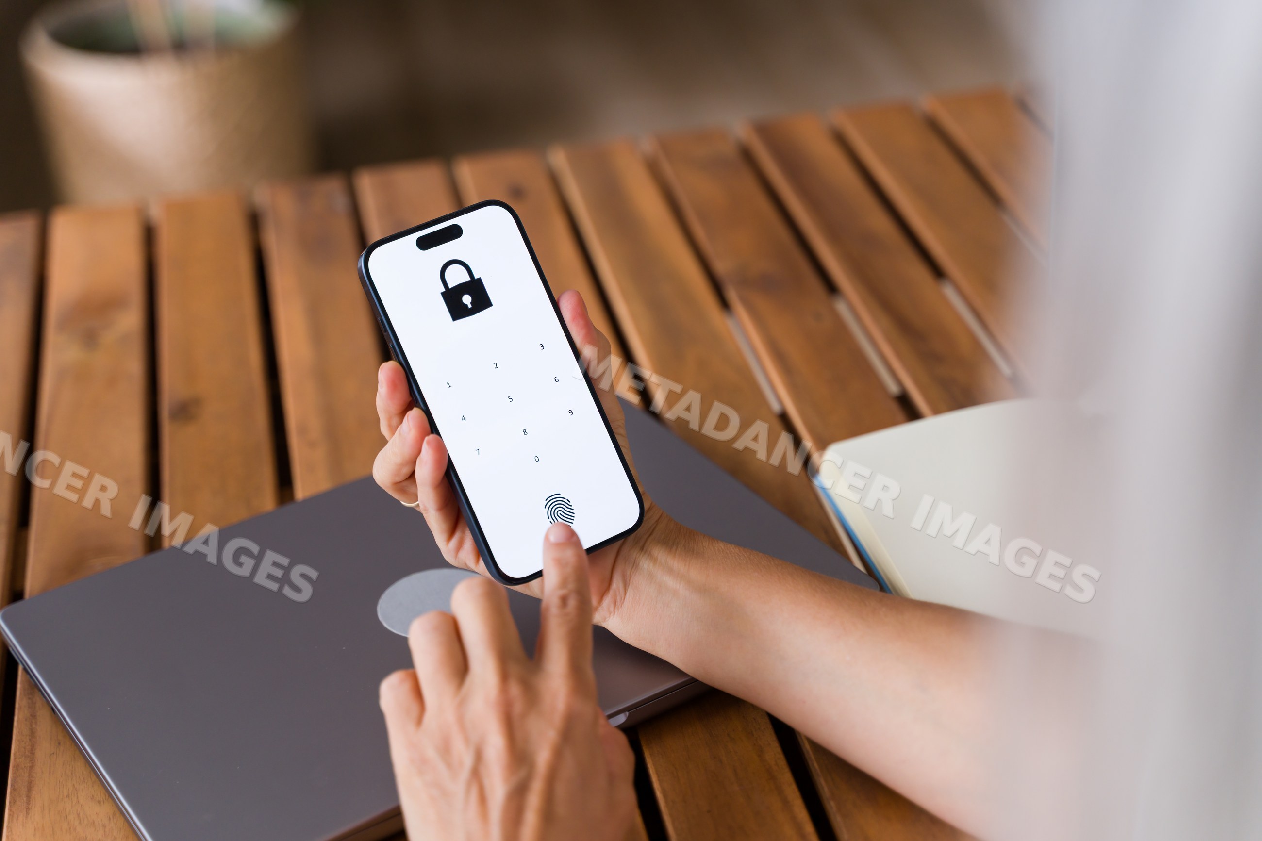 White Person unlocking smartphone with fingerprint on digital lock