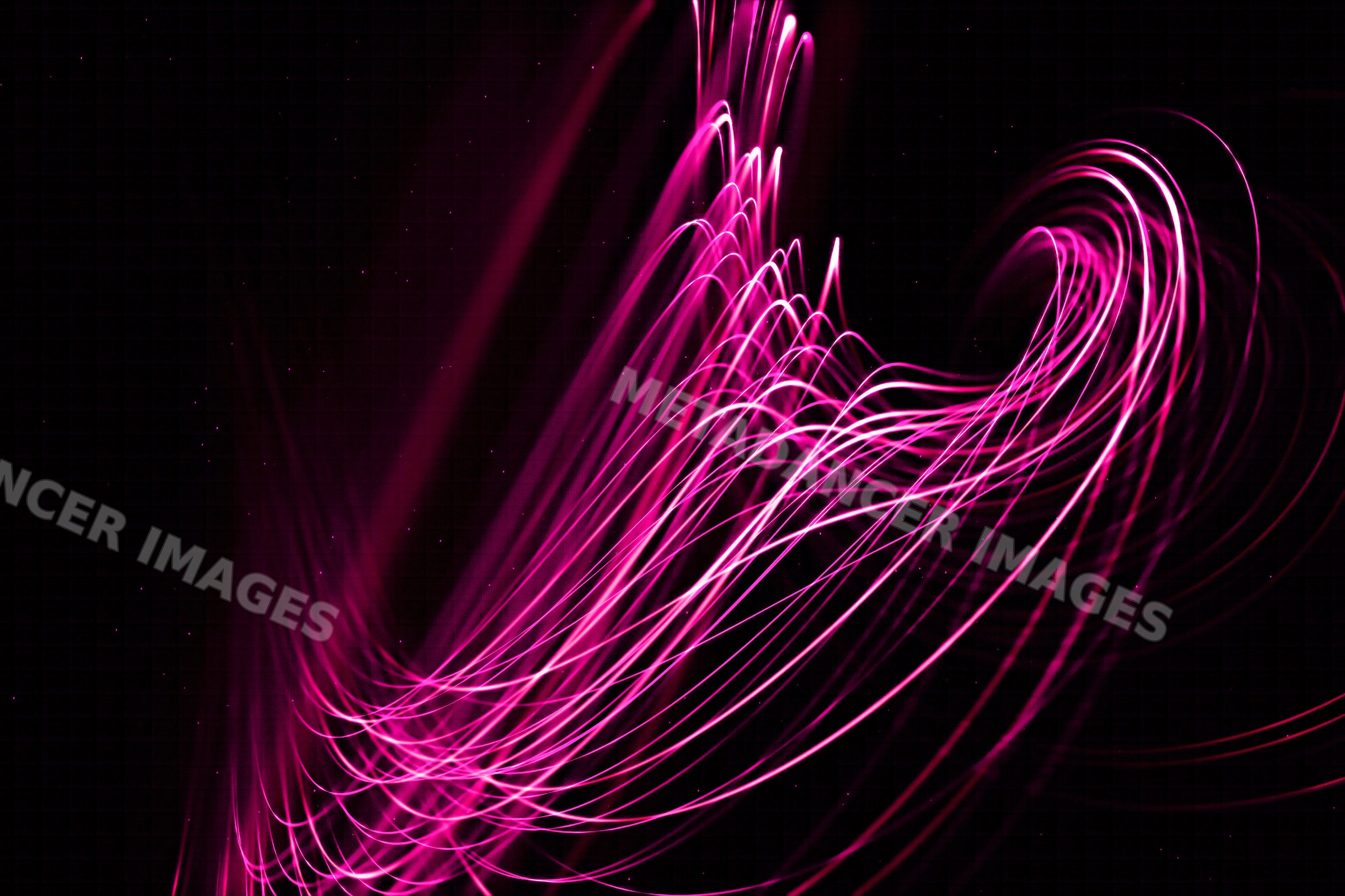 Pink light trails create abstract flowing patterns on a dark