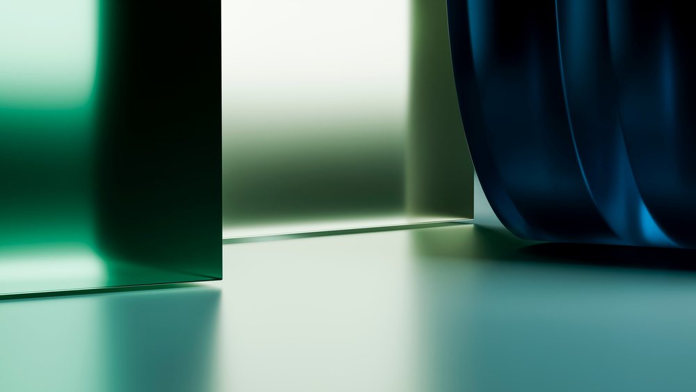 Abstract curved blue and green glass panels with light reflections