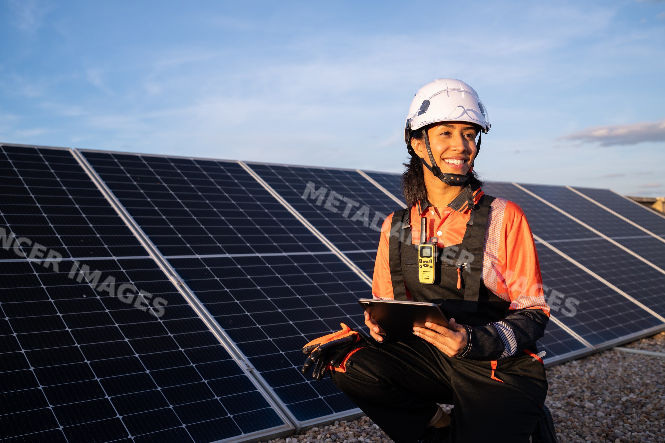 Solar technician Hispanic woman with tablet