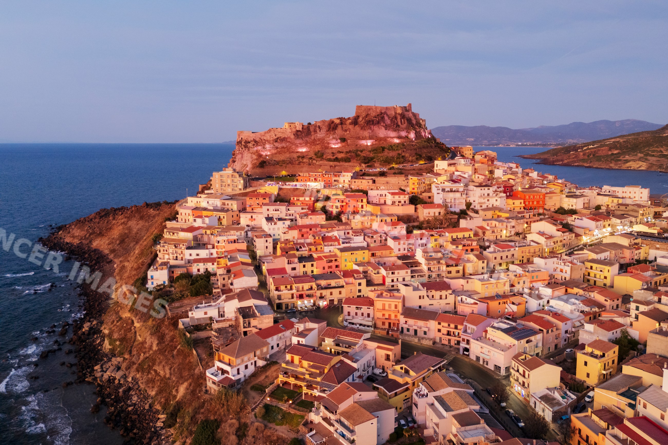 Castelsardo Citadel and coastal village at dusk in Sardinia Italy