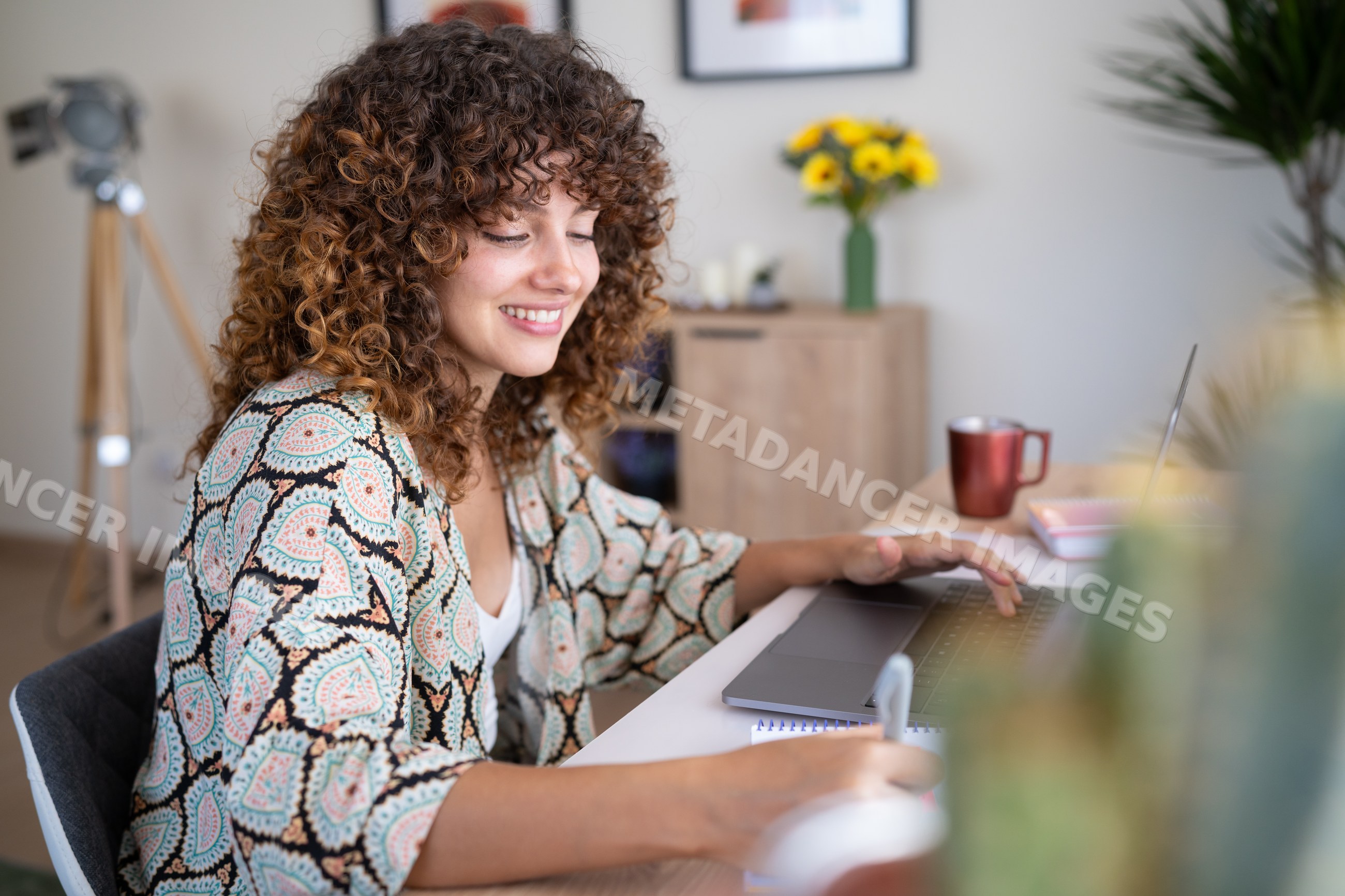 White woman working and writing