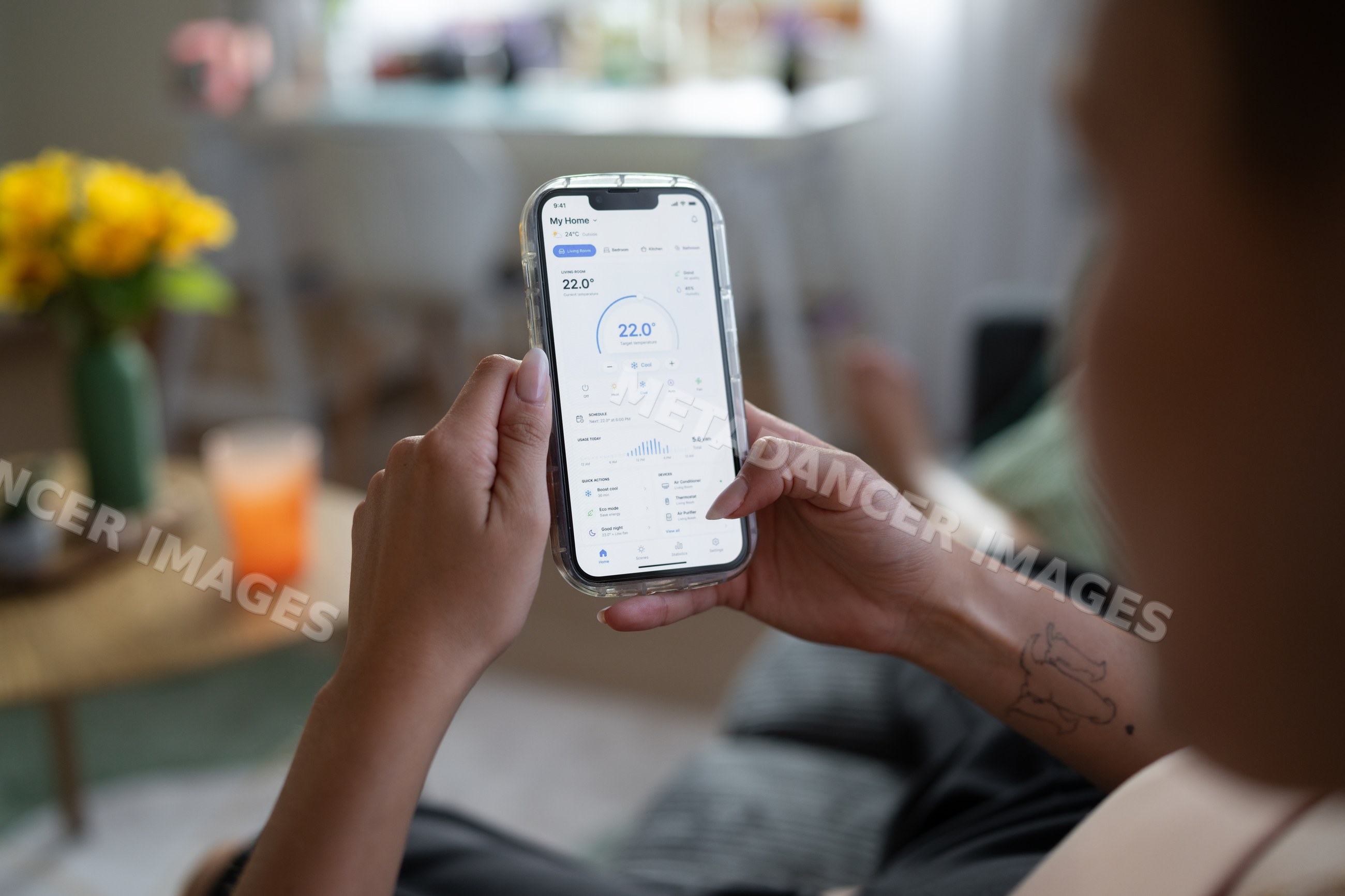 White Person adjusts temperature on smart home thermostat application