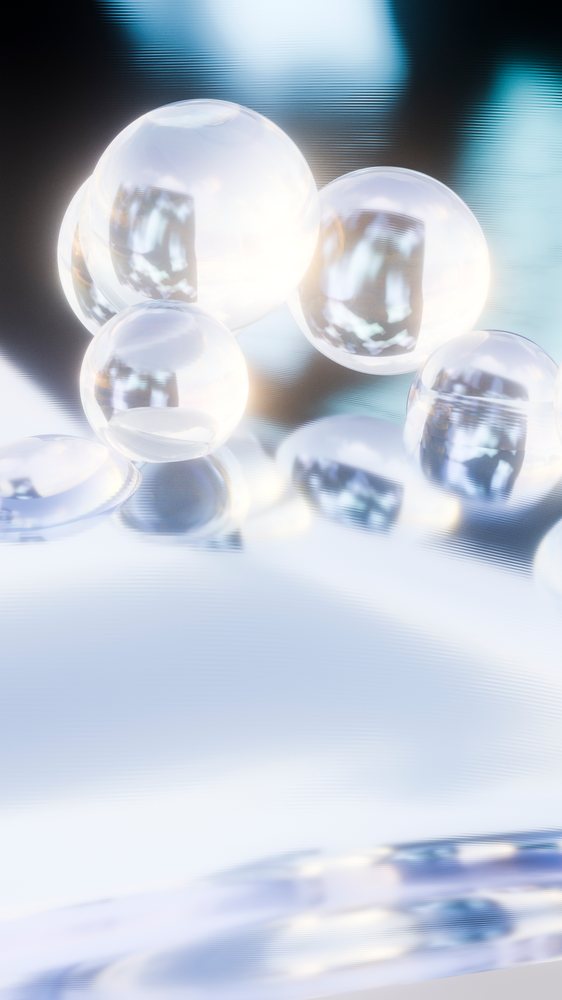 Close-up of transparent bubbles reflecting light on smooth liquid