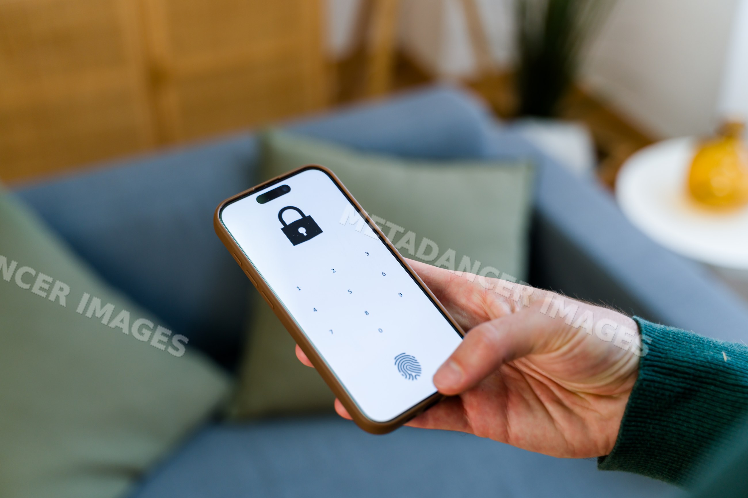 Smartphone displaying lock screen with numeric keypad and fingerprint