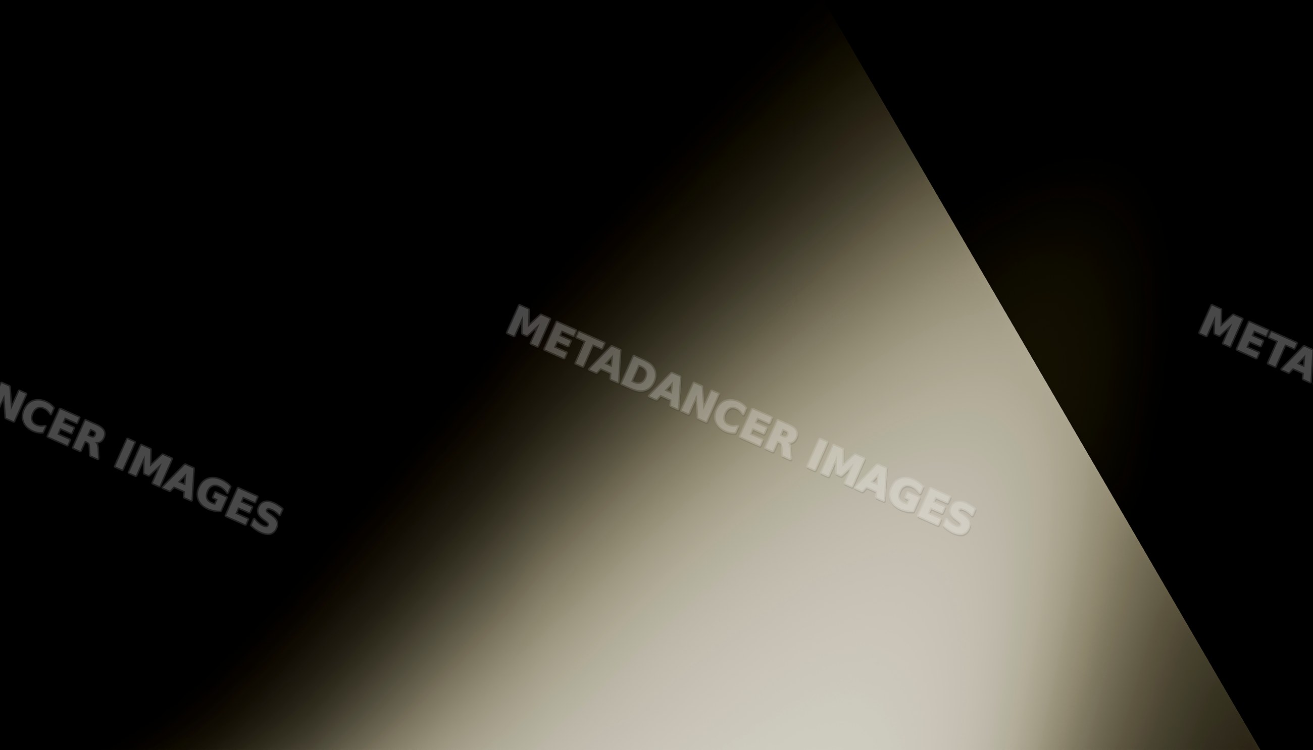Abstract diagonal light gradient fading into darkness