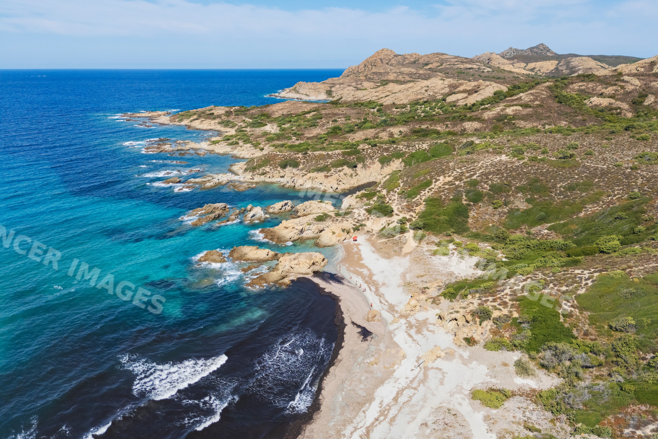 Rocky coastal shoreline at Plage de l'Ostriconi, ile rousse, corsica