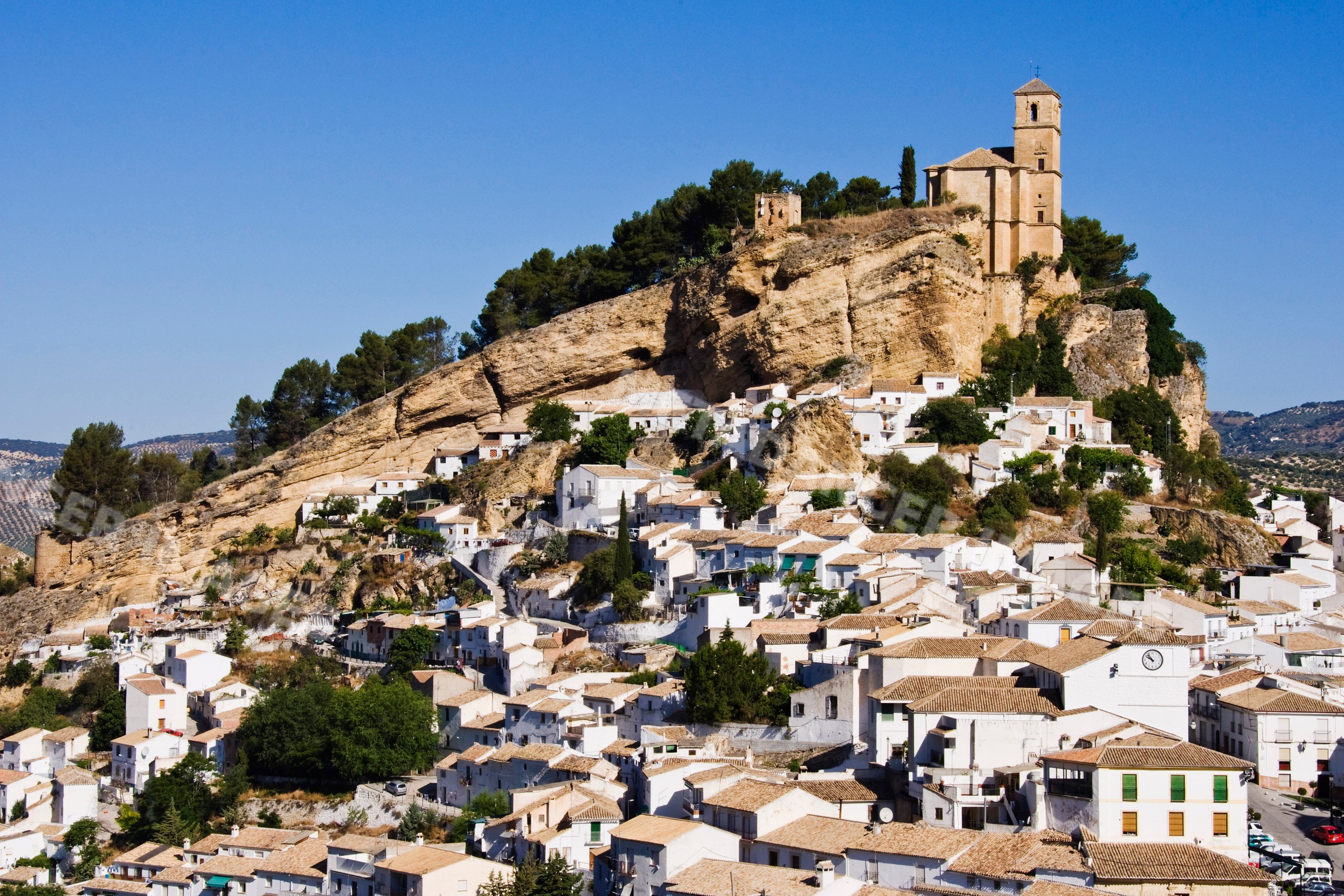 Montefrio village with hilltop church and white houses Spain