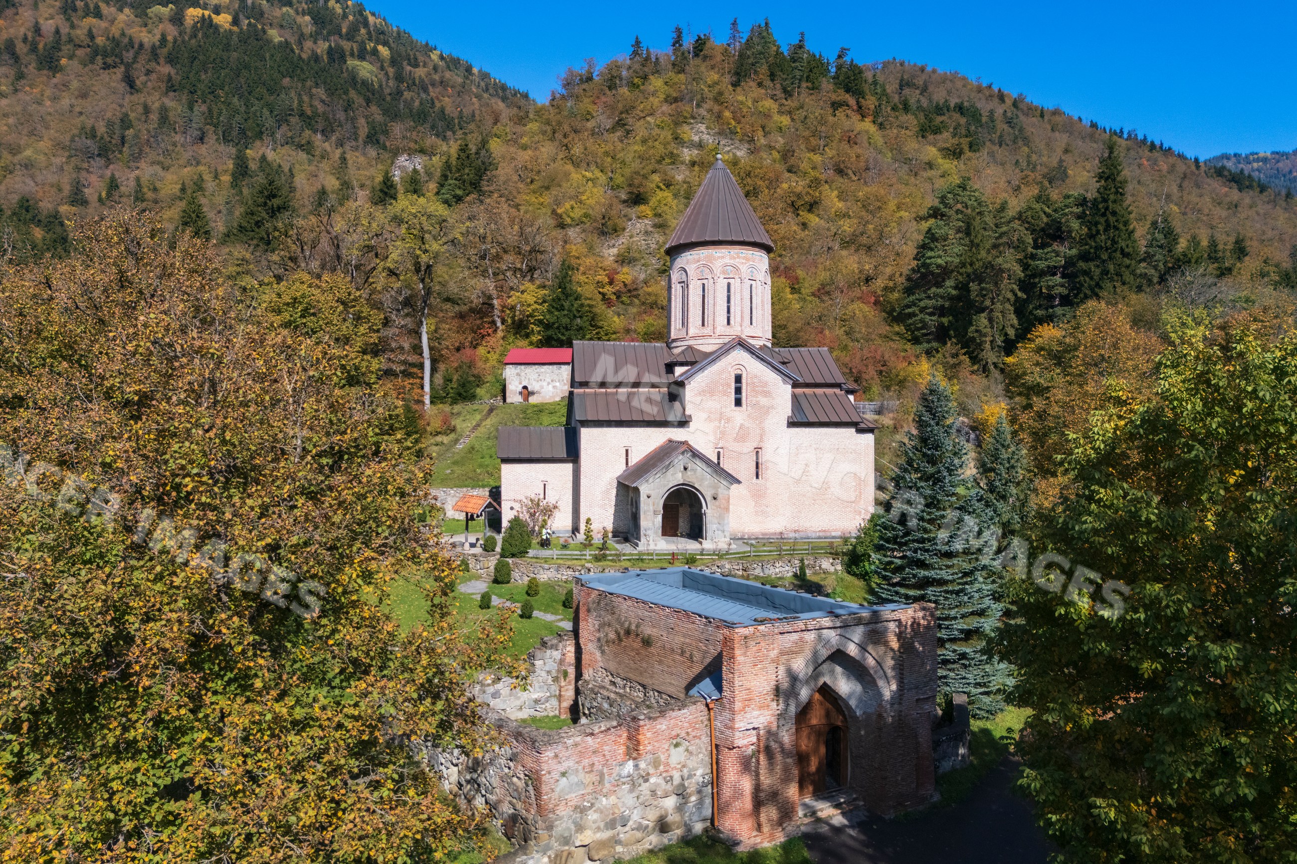 Tsagveri Timothesubvani Monastery with autumn forest