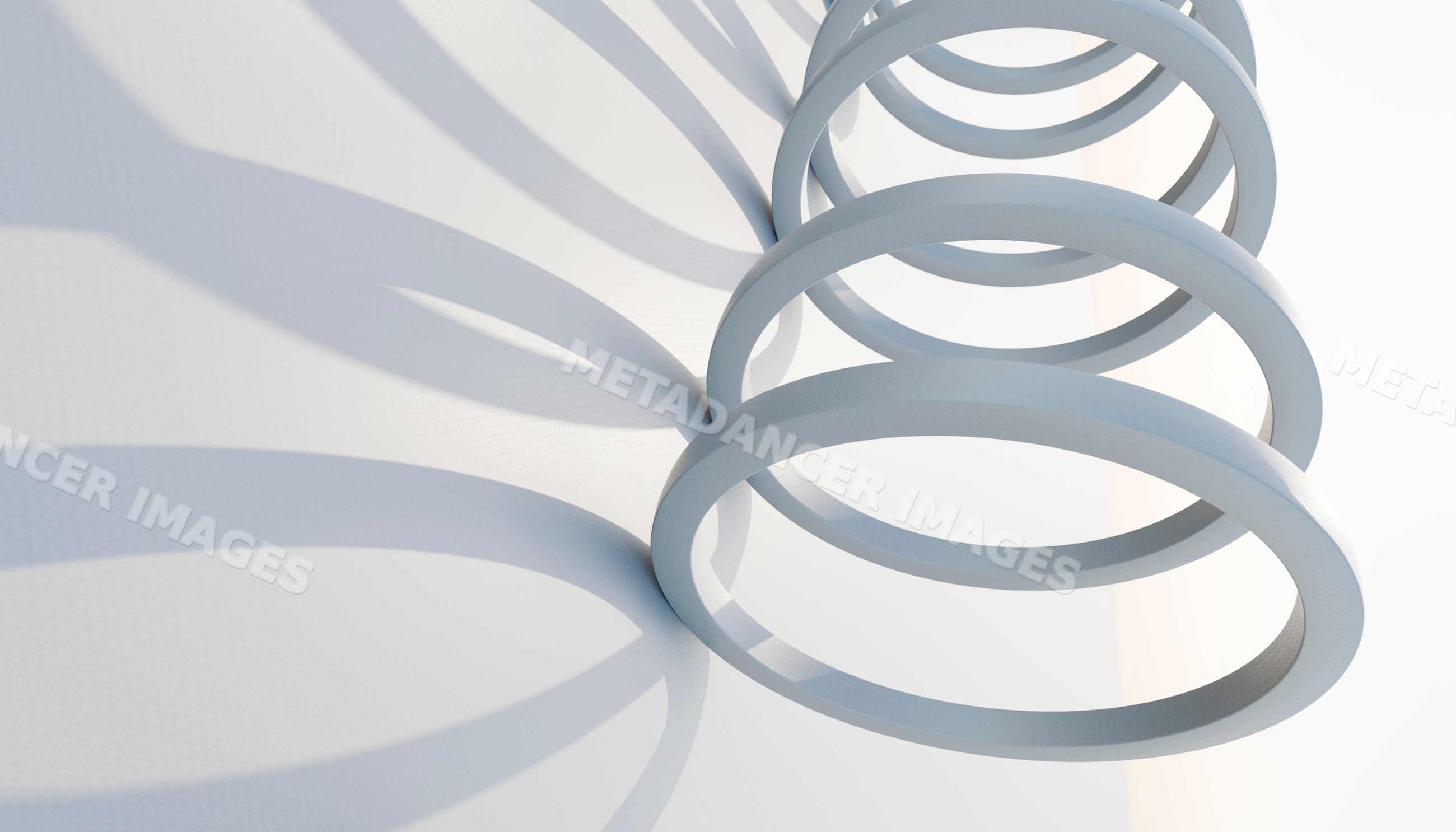 White circular rings create an abstract geometric pattern with shadows