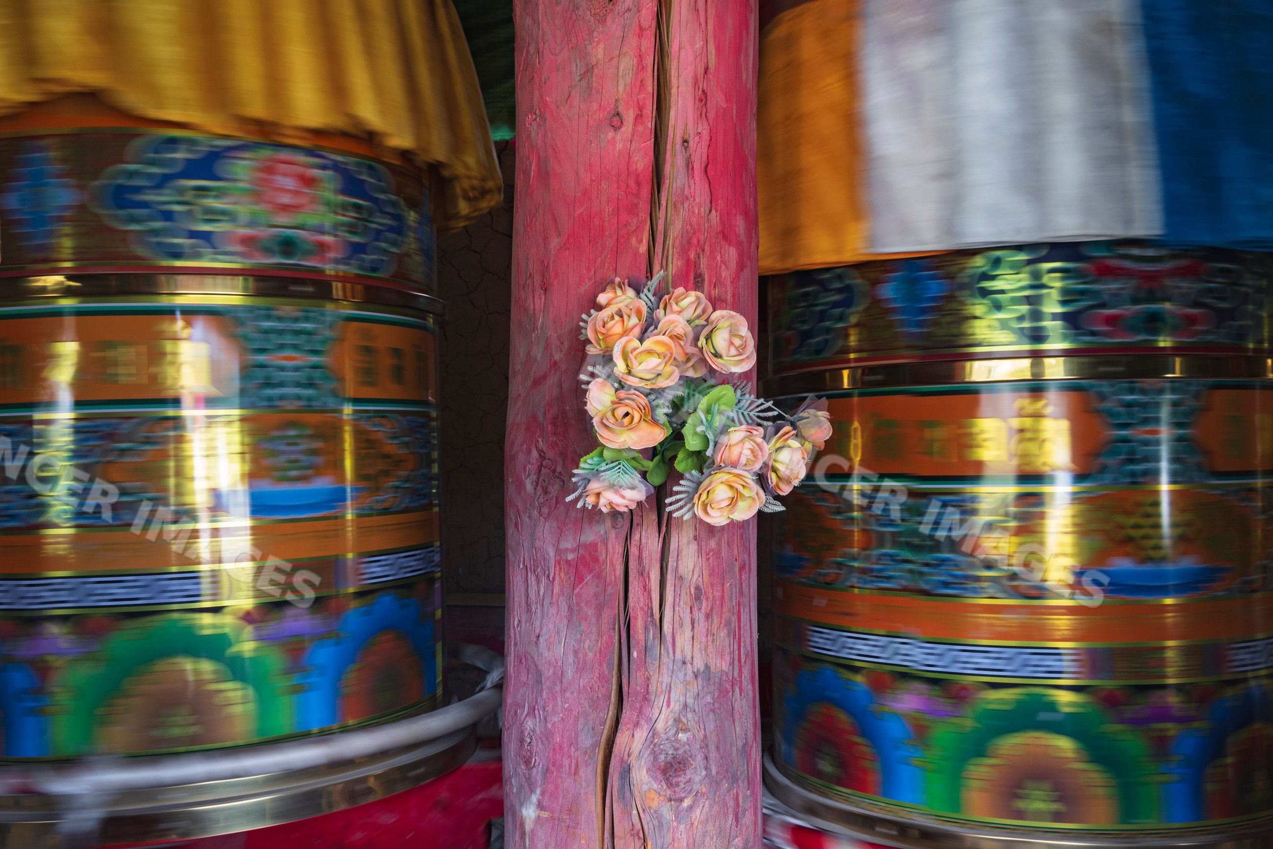 Spinning tibetan Prayer Wheels with floral decoration