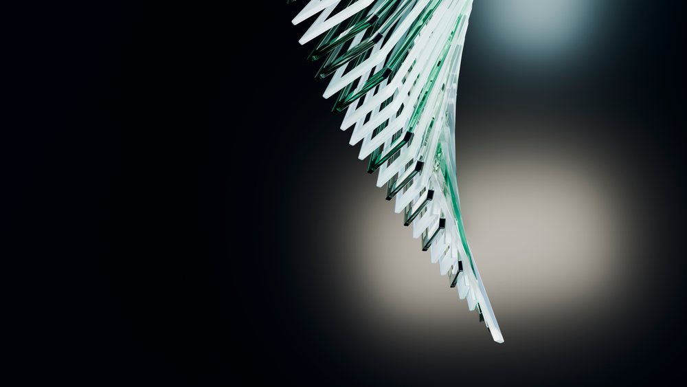 Abstract glass sculpture with stacked angled transparent plates