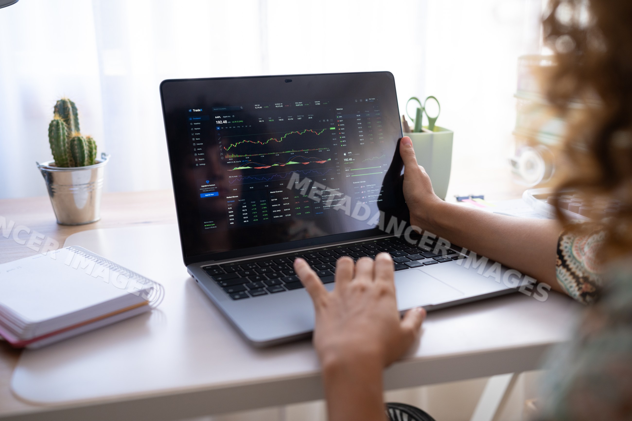 White girl using laptop for stock market trading