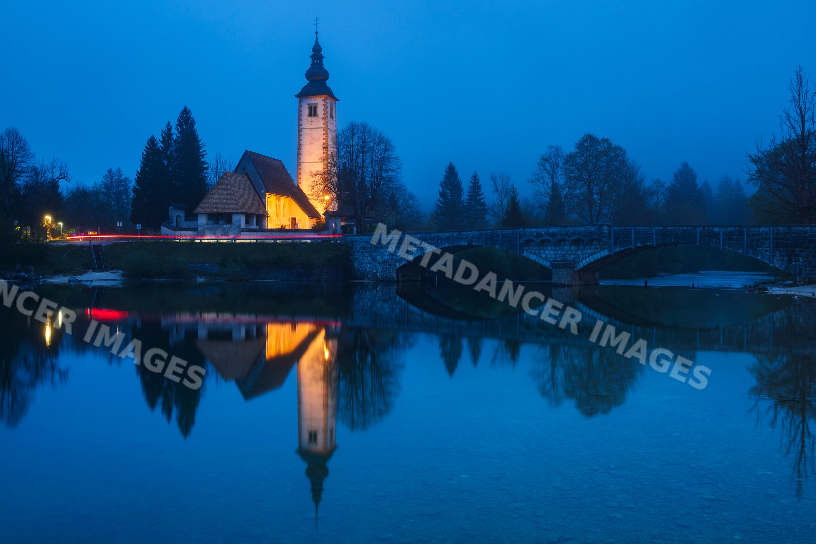 Church of st john the baptist with river reflection in bohinj Slovenia