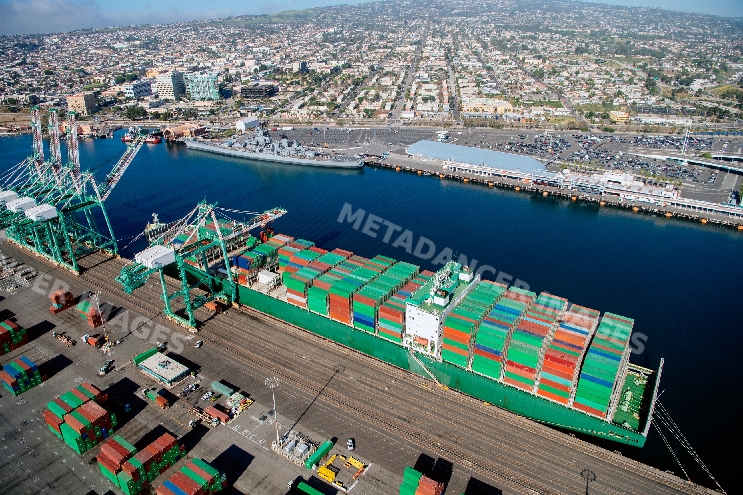 Container ship loaded with cargo containers in a beach